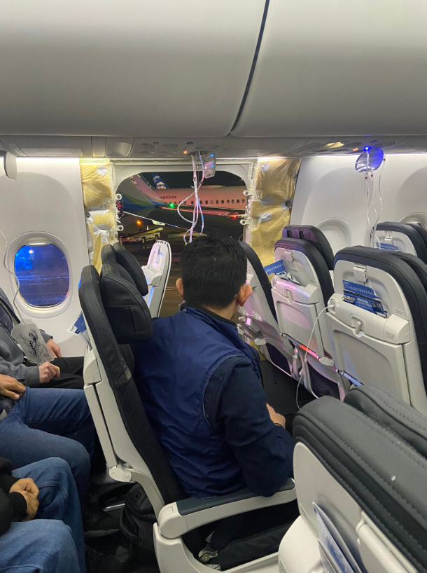 A photo shared on twitter of the Alaska Airlines plane after a section of the window and side wall blew out. Photo / Twitter