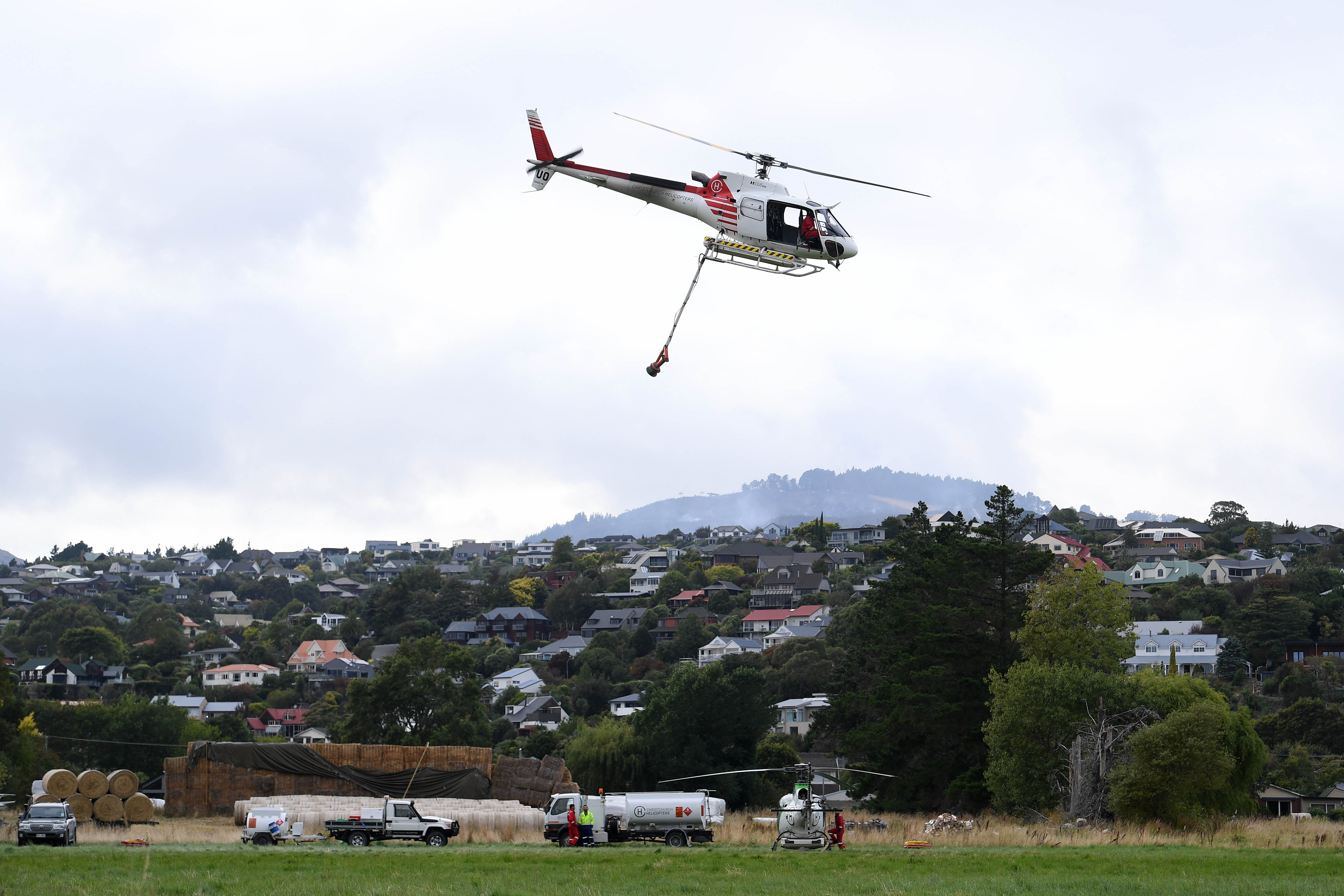 Helicopters prepare to take on day four. Photo / Joe Allison