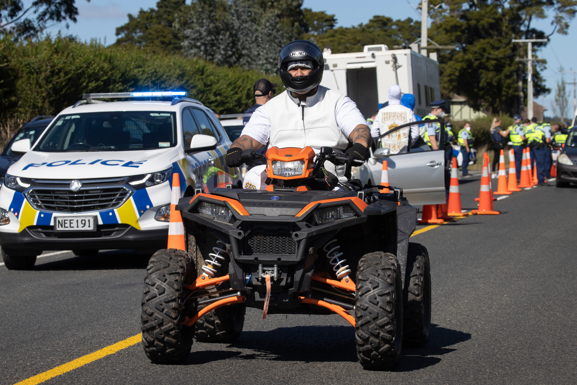 Killer Beez founder and president Josh Masters at a police checkpoint at Ramarama in April. Photo / Brett Phibbs