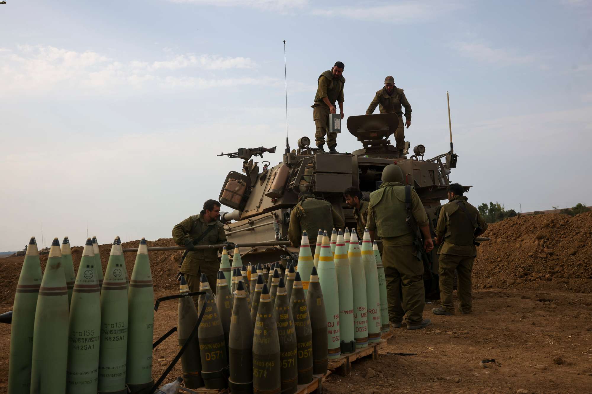 Israeli soldiers take position near the Israeli Gaza border in southern Israel. Photo / AP
