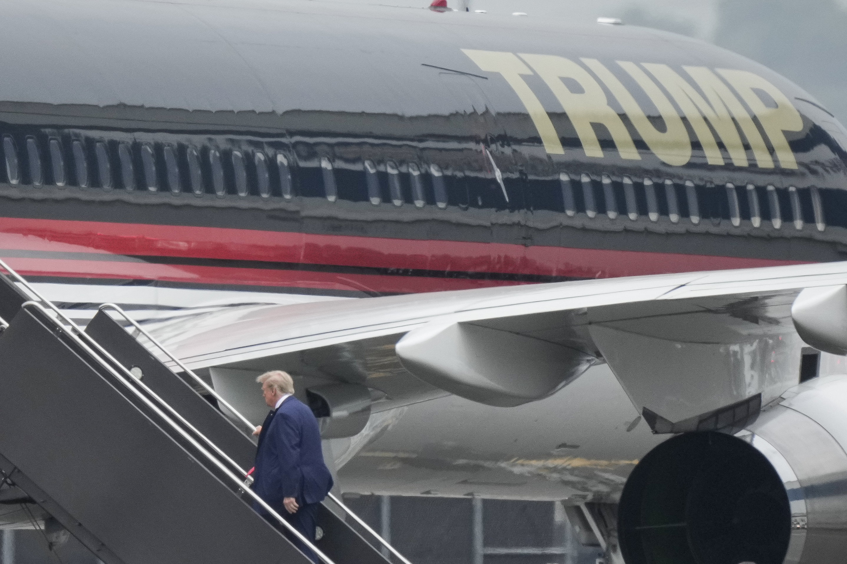 Former President Donald Trump boarding his airplane at Newark Liberty International Airport. Photo / Bryan Woolston, AP, File