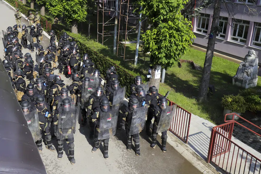 Hungarian soldiers serving in the Nato-led peacekeeping force KFOR guard a municipal building in the town of Zvecan, northern Kosovo. Photo / AP