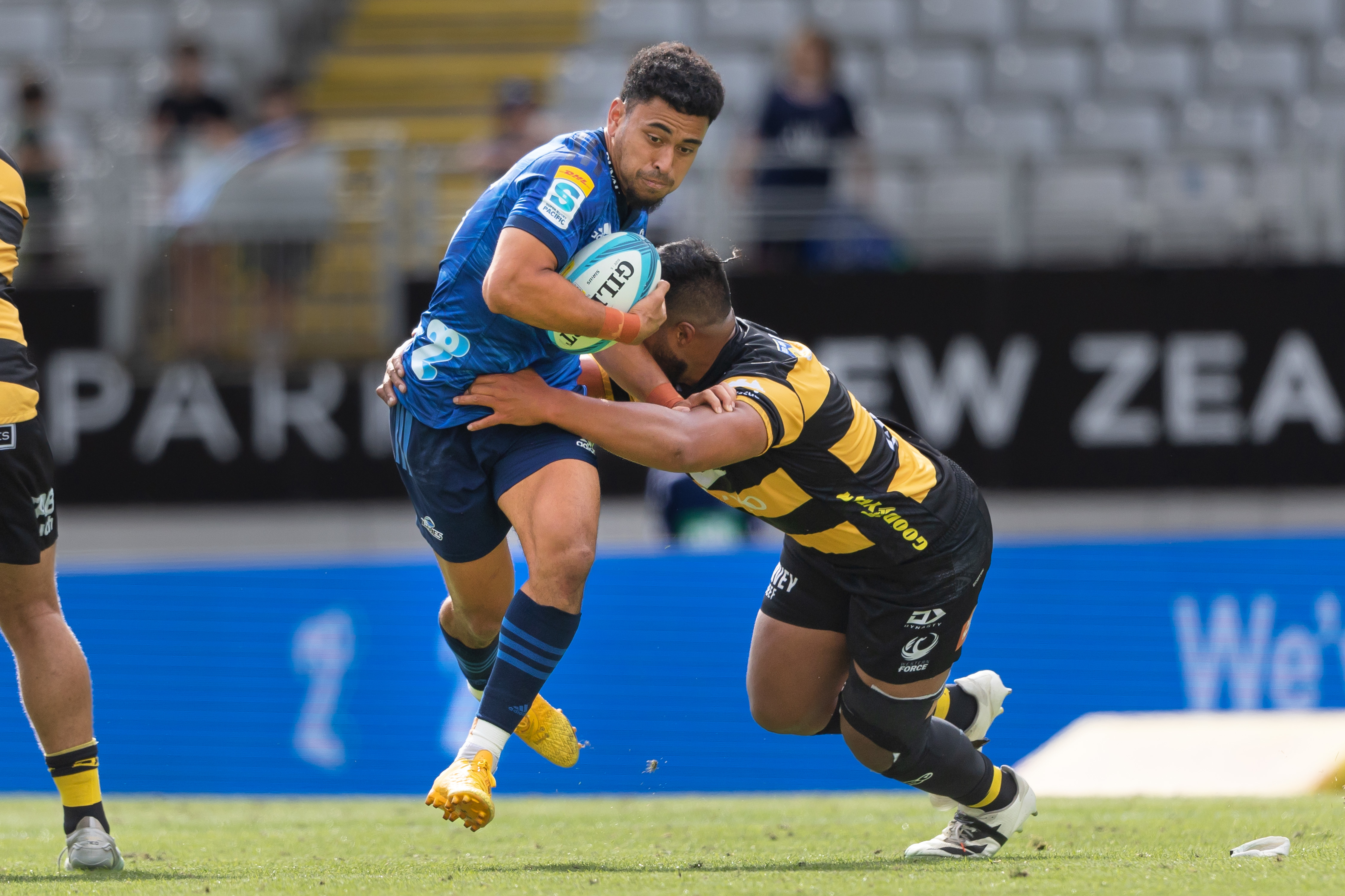 Stephen Perofeta of the Blues on attack against the Force. Photo / Photosport