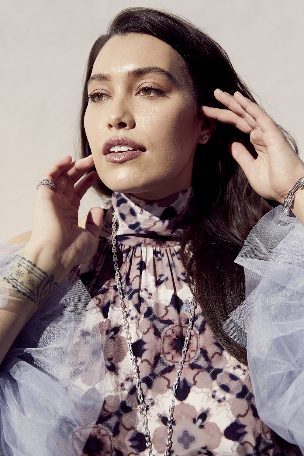 Isabella wears Juliette Hogan dress $949. Hera Couture sleeves (POA). Tiffany & Co. Victoria band $39,100, diamond bracelet $33,100, petal studs $13,900 and pendant $24,600. Photo / Mara Sommer