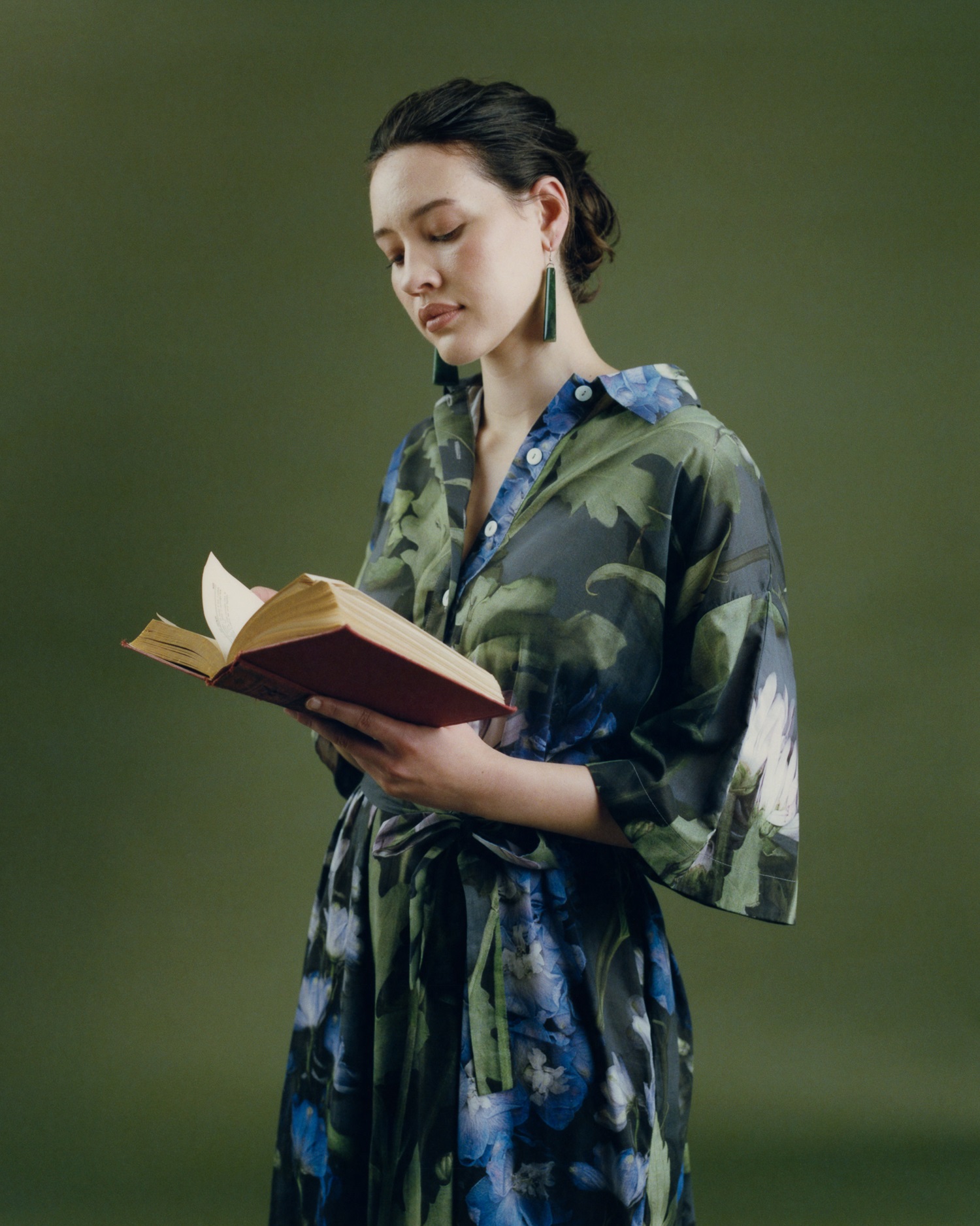 A catalogue of gifts for the people who struggle to pull their eyes from the page. Fabienne wears Kowtow dress and Kiri Nathan earrings. Photo / Jerome Warburton