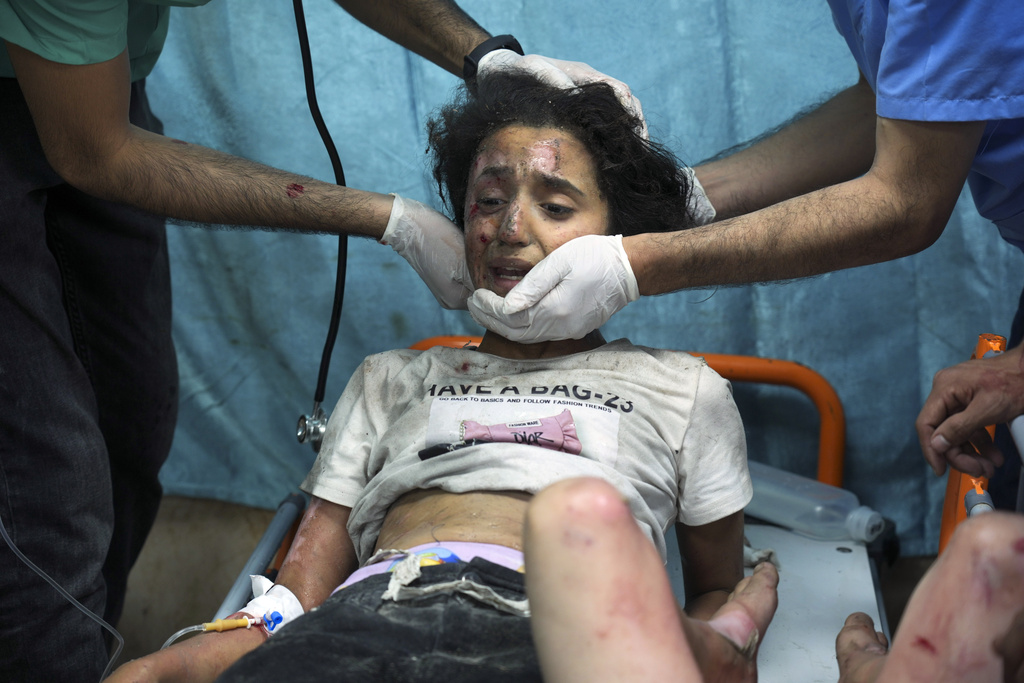 A Palestinian child wounded in Israeli bombardment is treated in a hospital in Deir al-Balah, southern Gaza Strip on October 17. Photo / AP