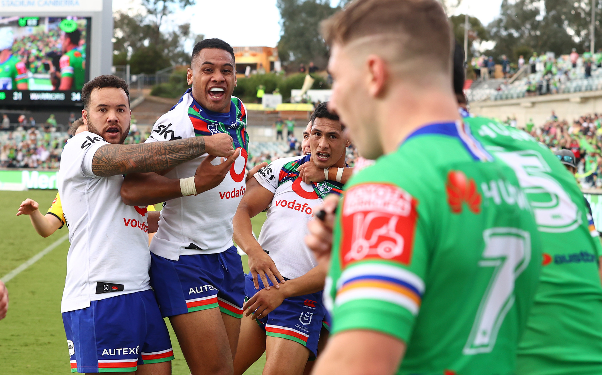 Warriors players celebrate a try saving tackle by Roger Tuivasa-Sheck. Photo / Photosport.co.nz