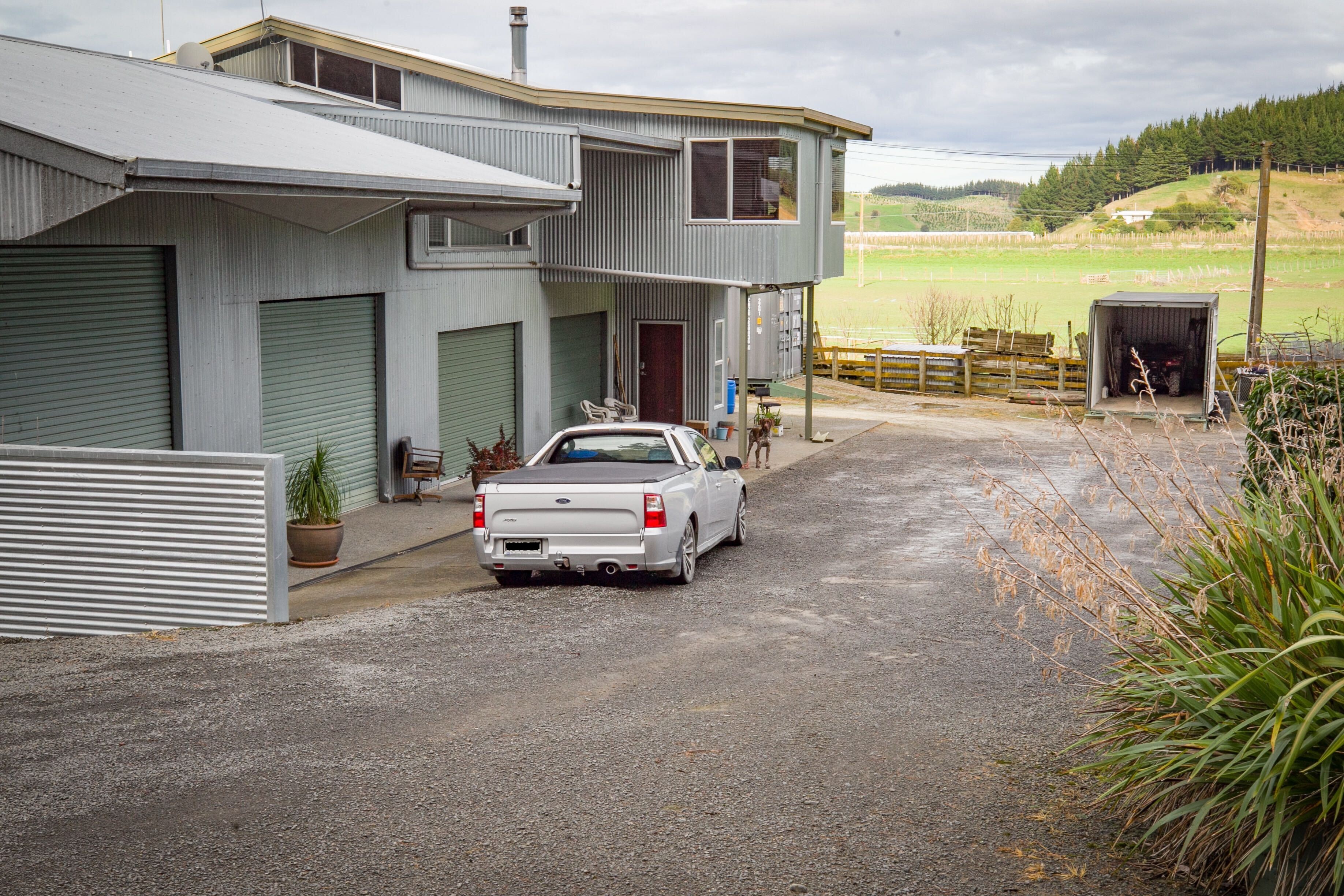 Floodwaters just reached the containers at the end of the driveway, but did not make it to Barry Hoy's house during the cyclone. Photo / Warren Buckland