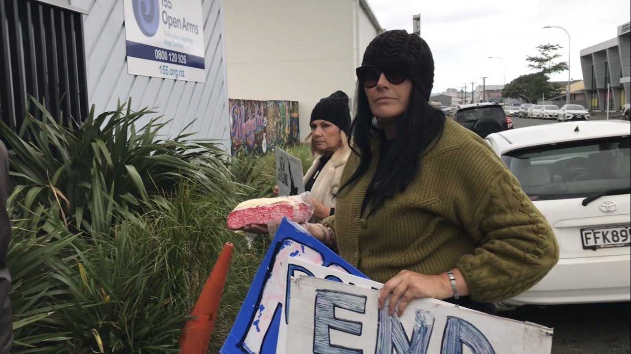 One woman brought a lamington to the protest. Photo / David Fisher