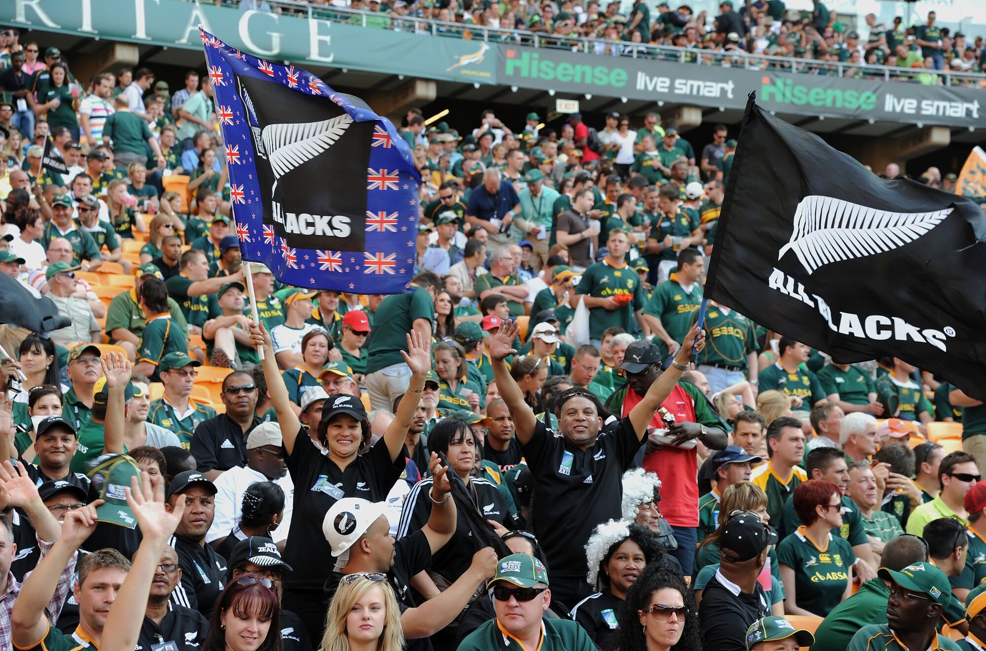 Locals fans cheer on the All Blacks in South Africa. Photo / Photosport