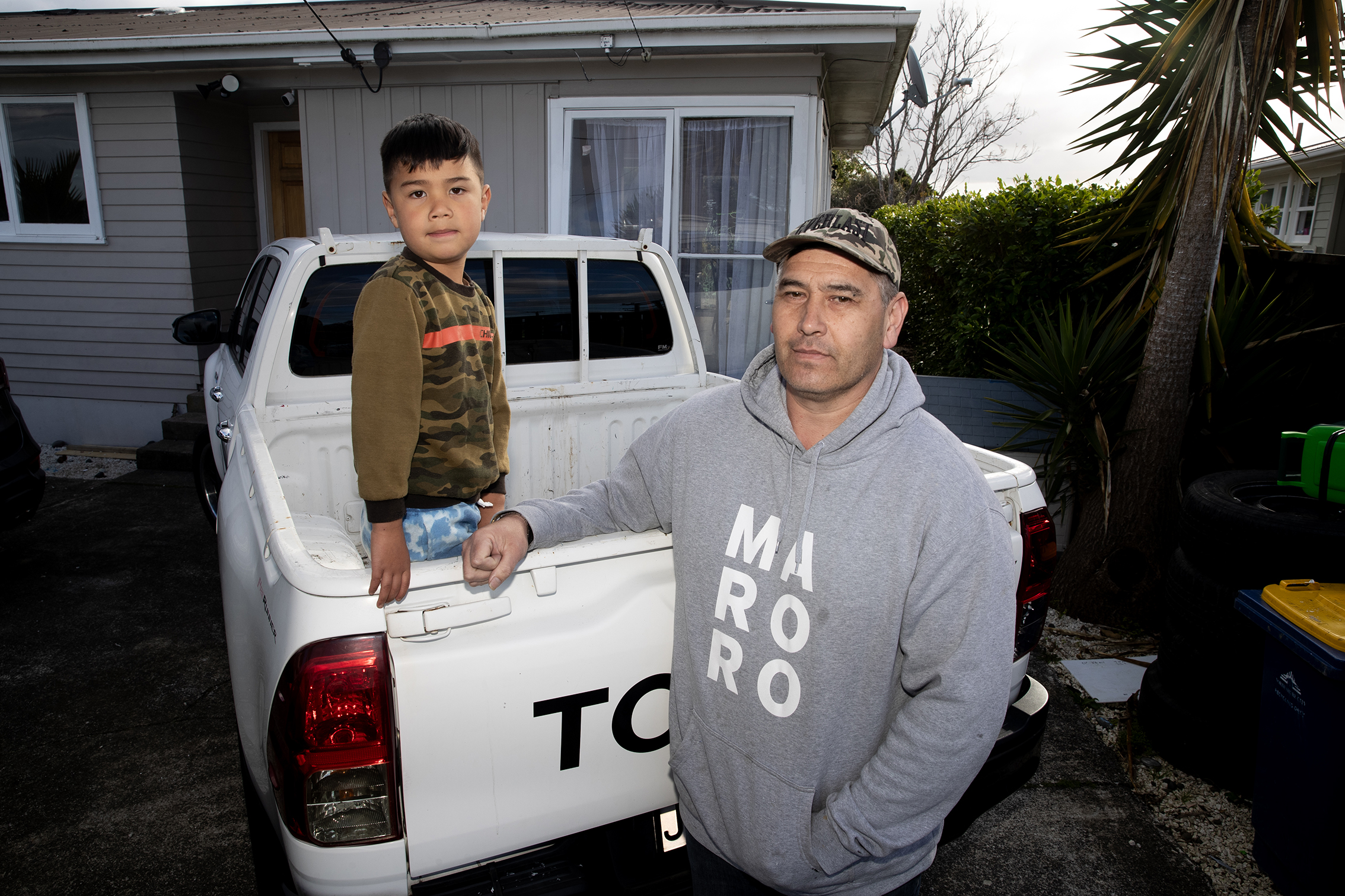 William Macneil with his son Lucky, age 5. The family have complained to Kāinga Ora after a terrifying run-in with the next-door tenants. Photo / Dean Purcell