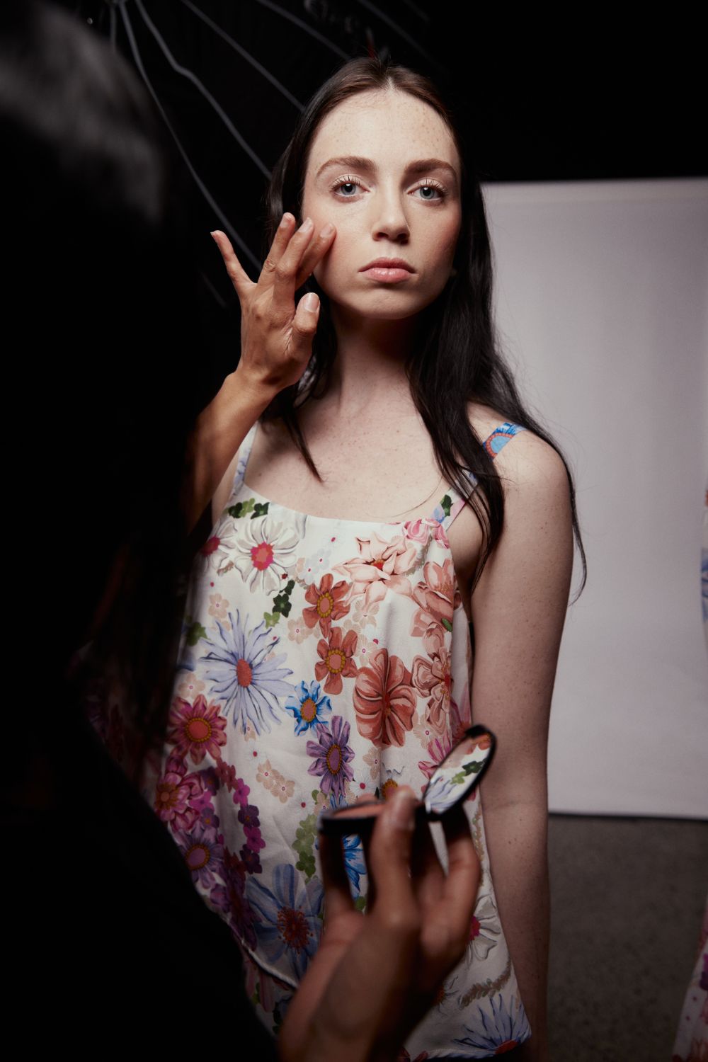 A quick blush touch-up backstage at Juliette Hogan. Photo / Holly Burgess