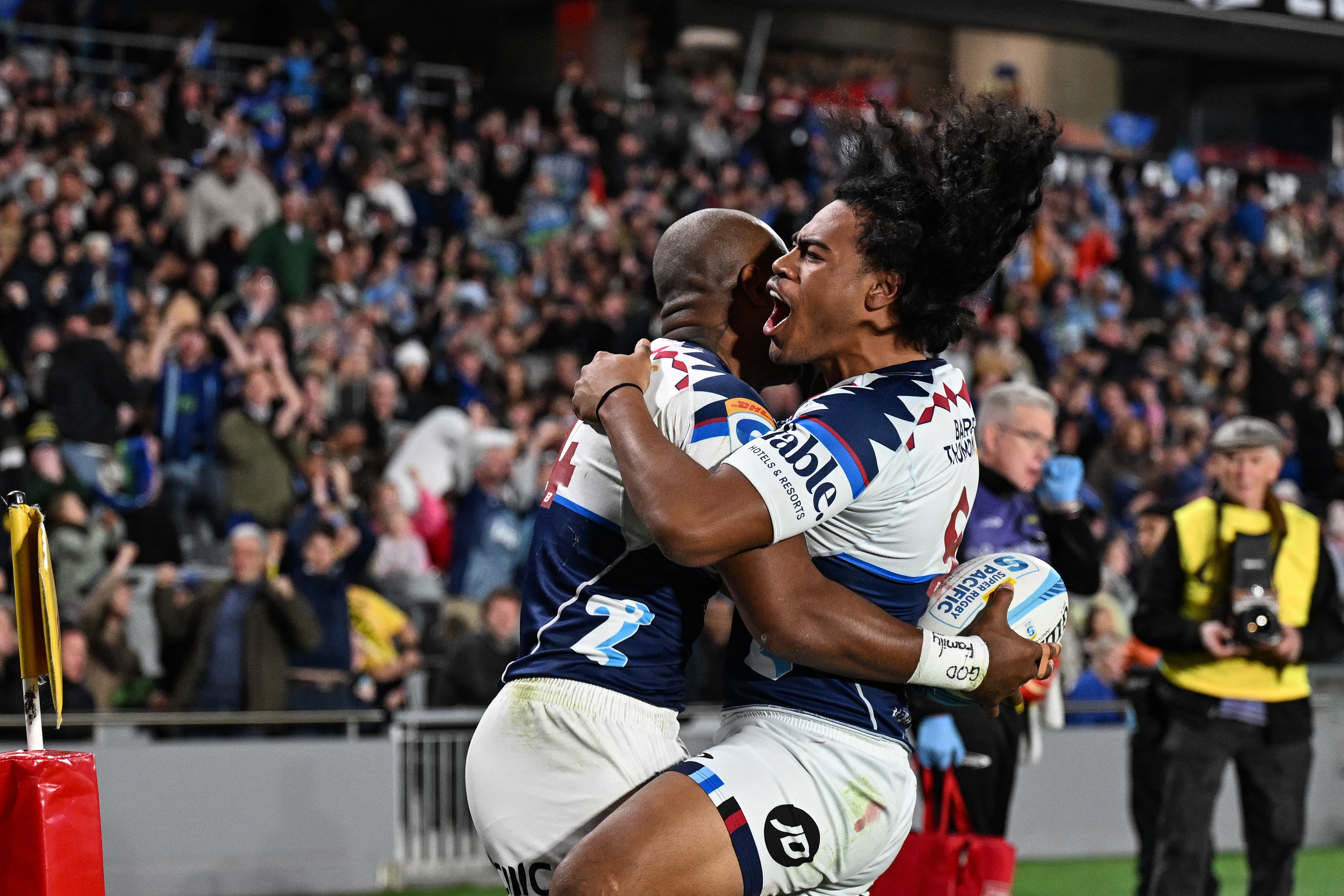 Mark Telea of the Blues celebrates his try with Taufa Funaki. Photo / Photosport