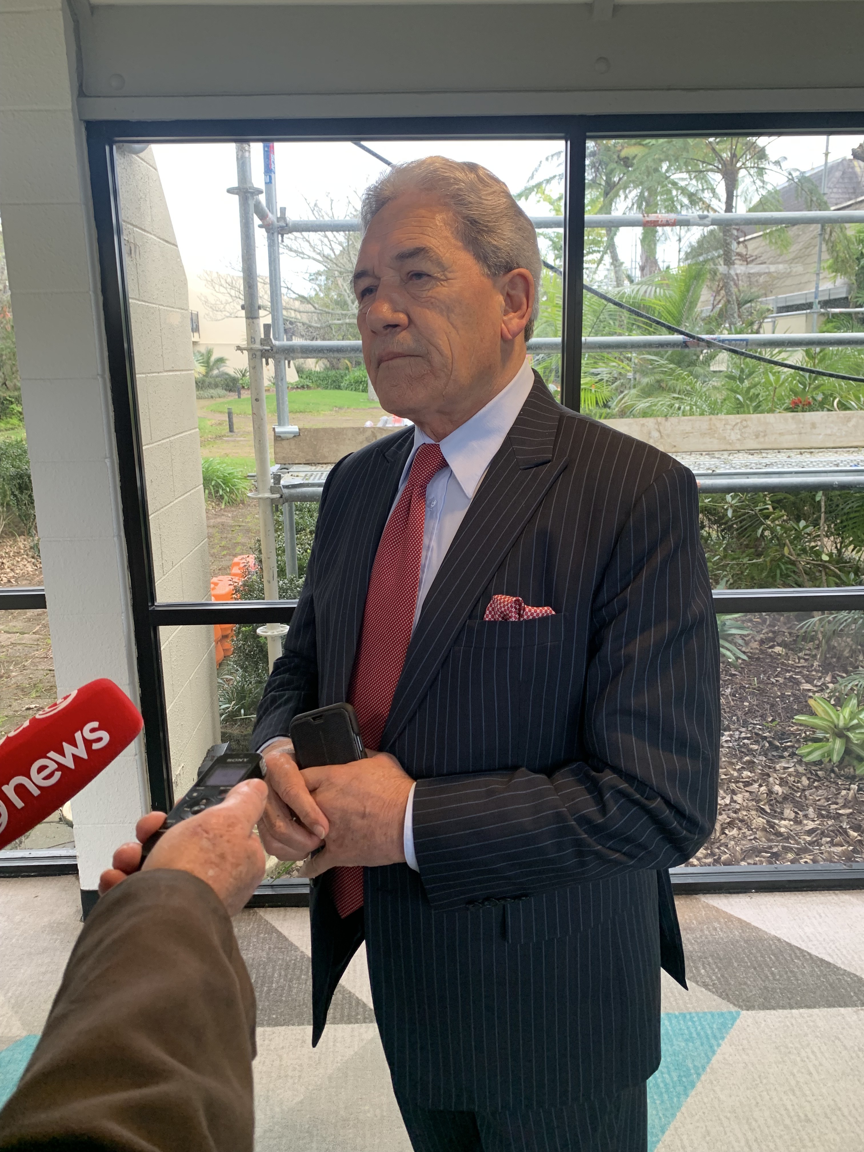 NZ First leader Winston Peters speaks with media at his party's convention. Photo / Adam Pearse