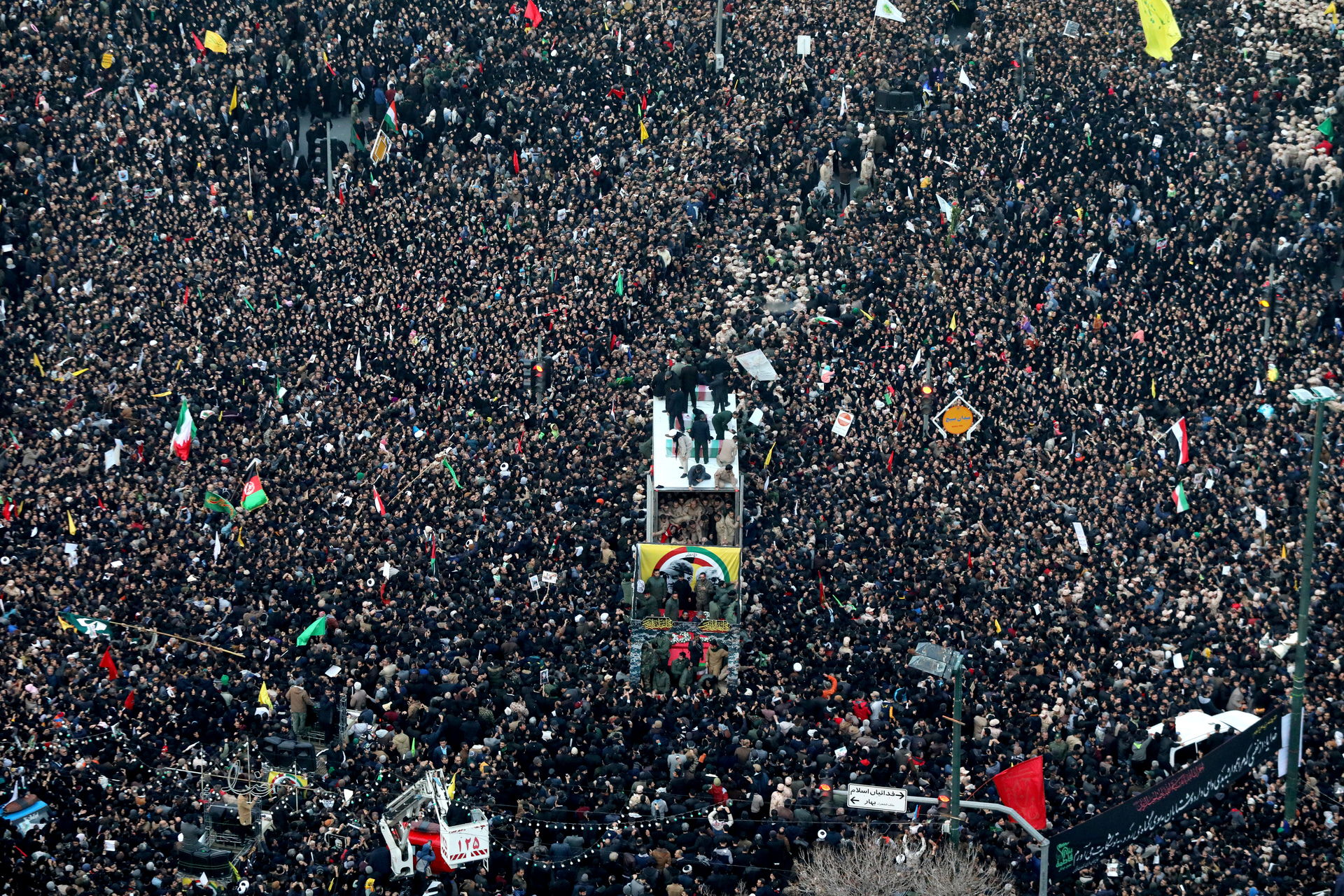 Qassem Soleimani and his comrades who were killed in Iraq by a U.S. drone strike, are carried on a truck surrounded by mourners during a funeral procession. Photo / AP