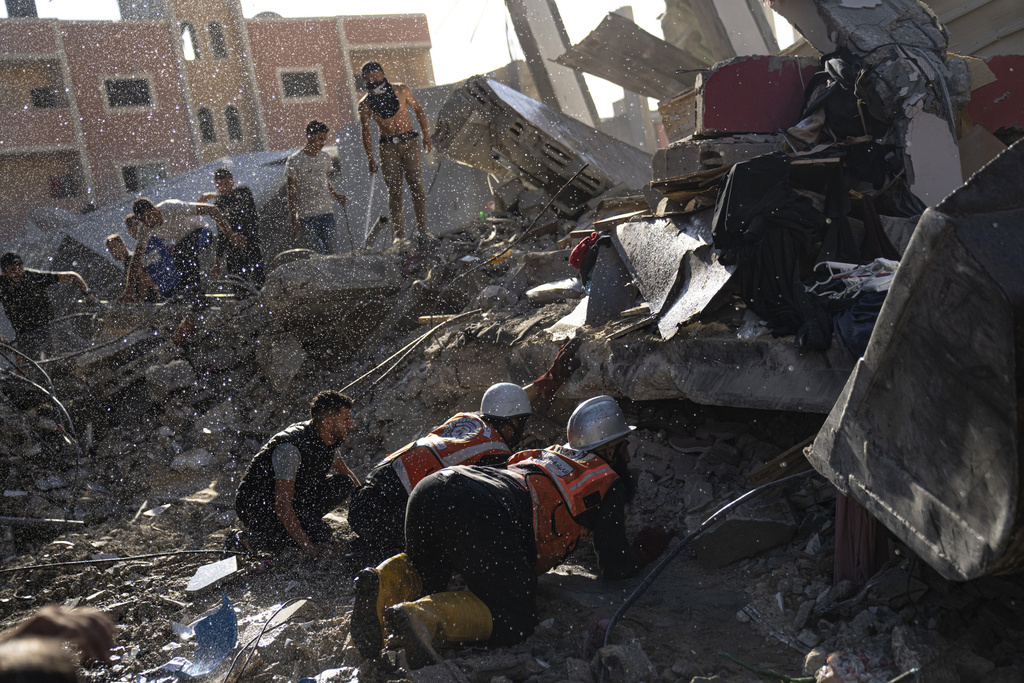 Palestinians look for survivors after an Israeli airstrike on Khan Younis, Gaza Strip on October 17. Photo / AP