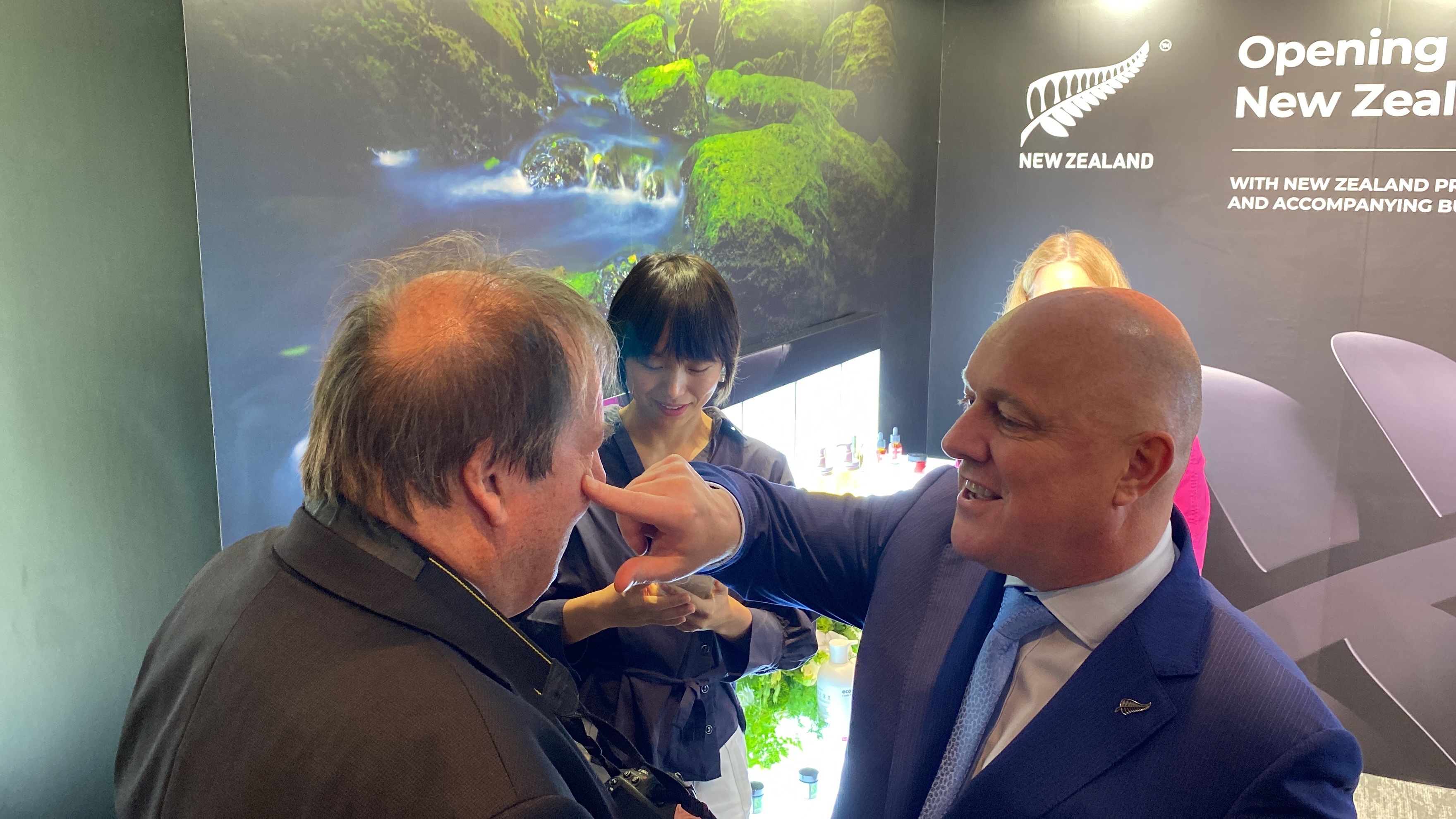 Prime Minister Christopher Luxon applies Antipodes skincare to Politik's Richard Harman. Photo / Thomas Coughlan