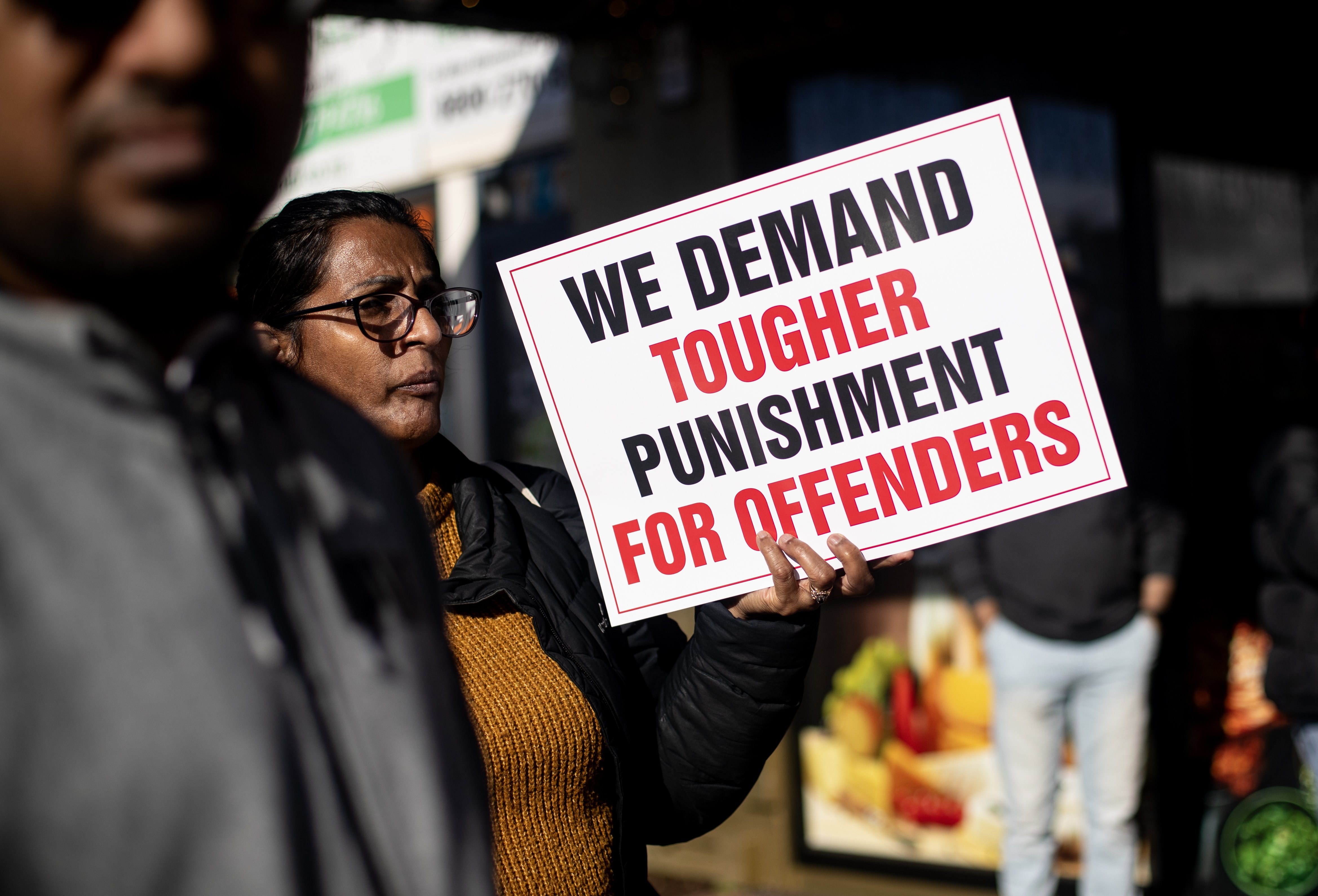 Indian business owners protest in Papatoetoe calling for stronger punishment for youth offenders. Photo / Dean Purcell