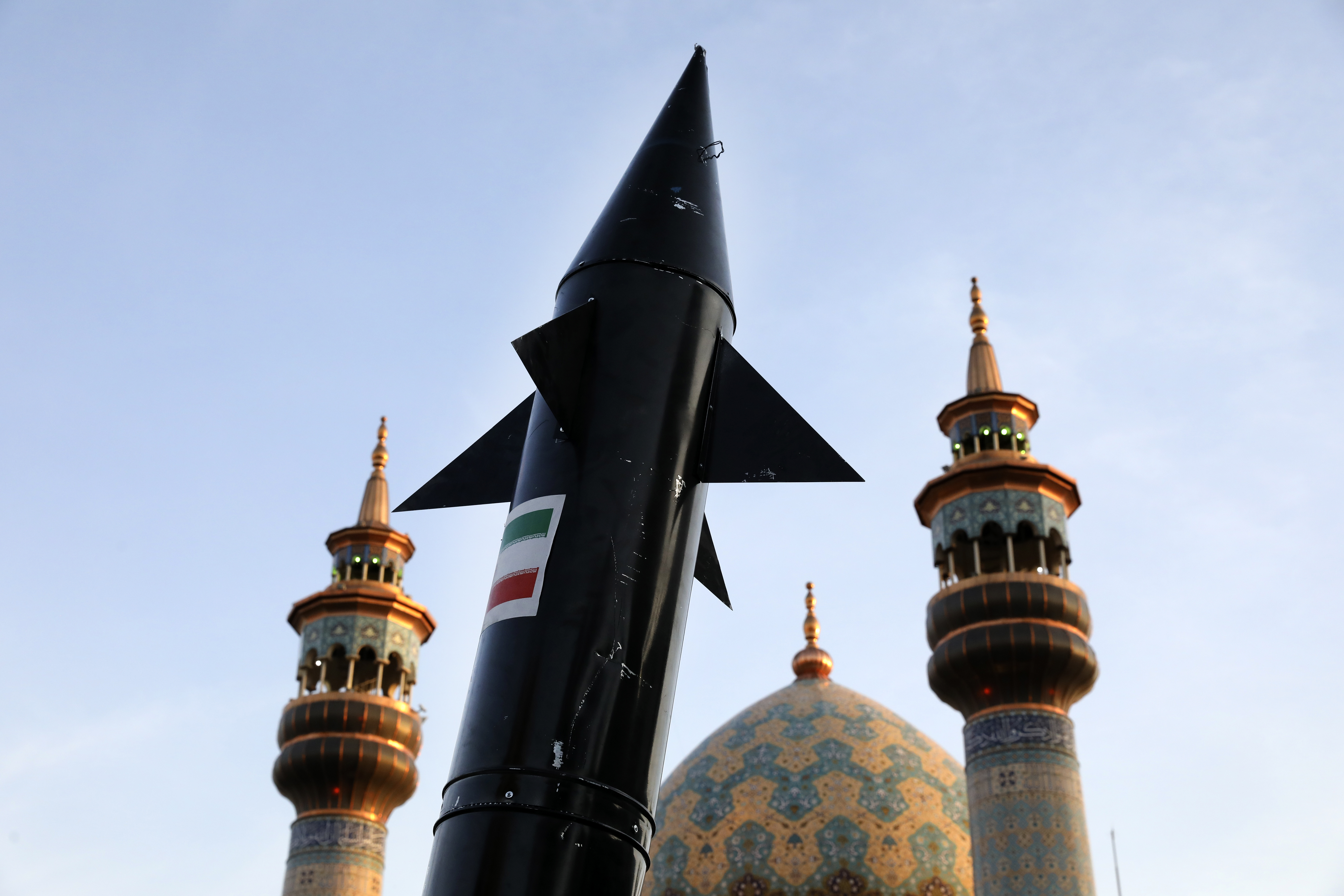 A model of a missile is carried by Iranian demonstrators. Photo / AP