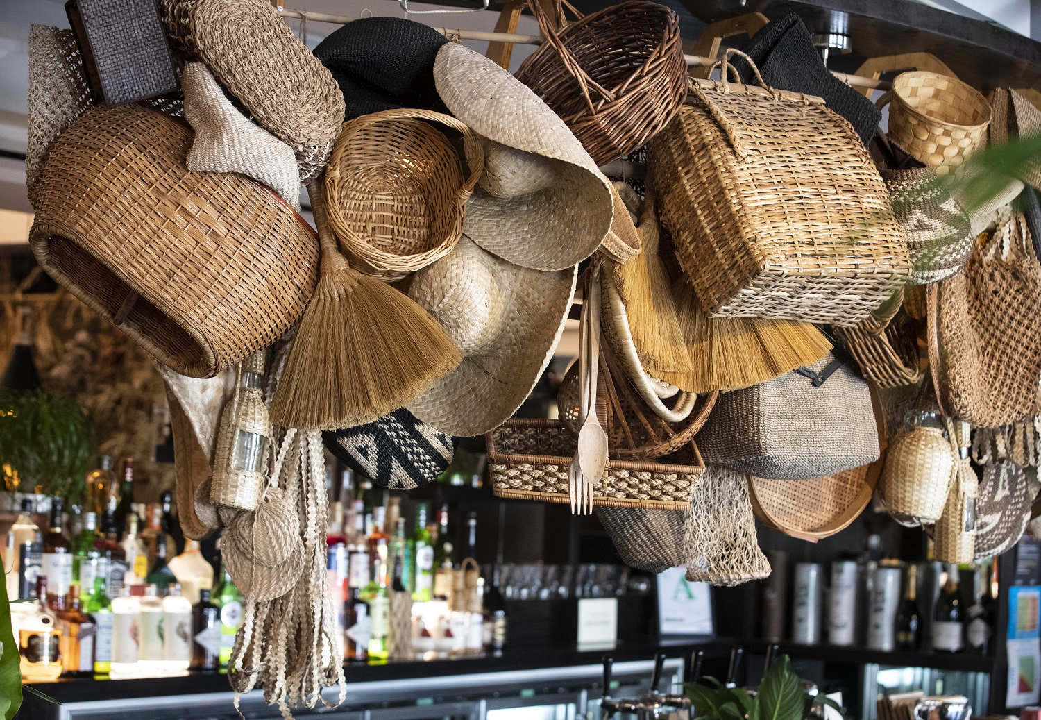 The interior features a display of straw hats and baskets. Photo / Jason Oxenham