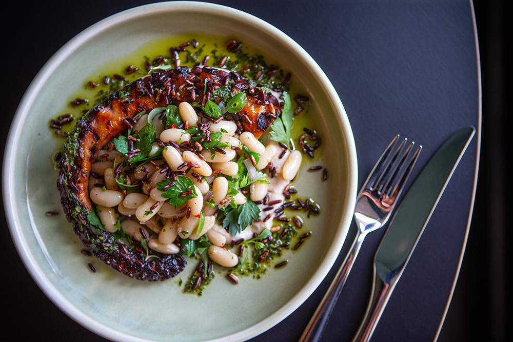 The grilled octopus with white beans and mint salsa verde. Photo / Supplied