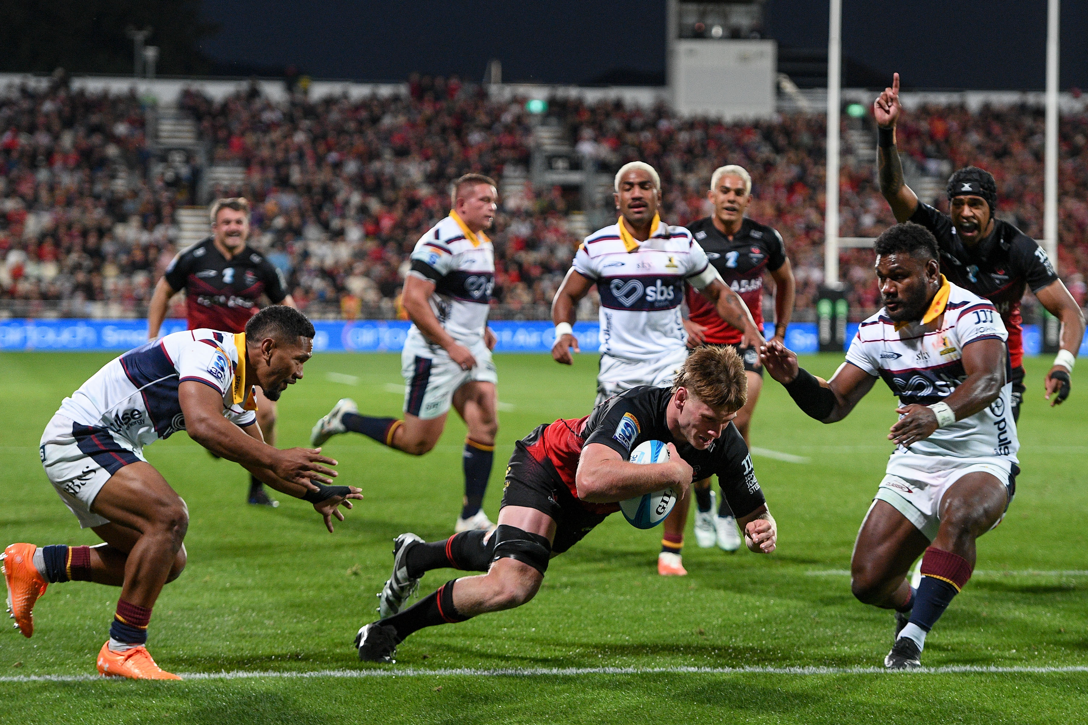 Johnny Lee scored a double in his first Super Rugby appearance as the Crusaders beat the Highlanders. Photo / Photosport