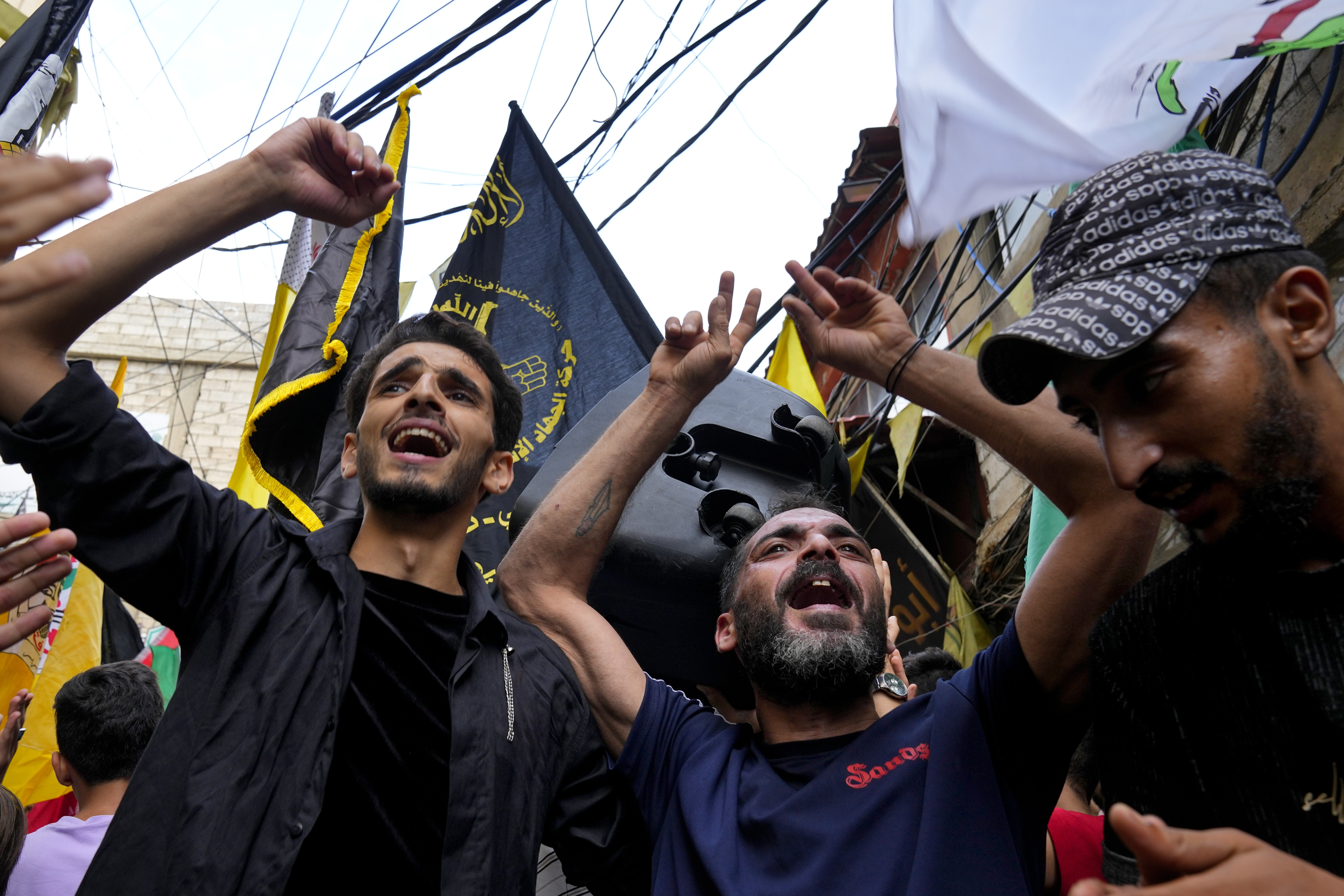 People dance in celebration of the attacks that the militant Hamas group carried out against Israel, at Bourj al-Barajneh Palestinian refugee camp. Photo / AP