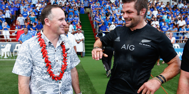 John Key and Richie McCaw enjoy a moment together after the International Test match between Samoa and the All Blacks. Photo / Getty Images