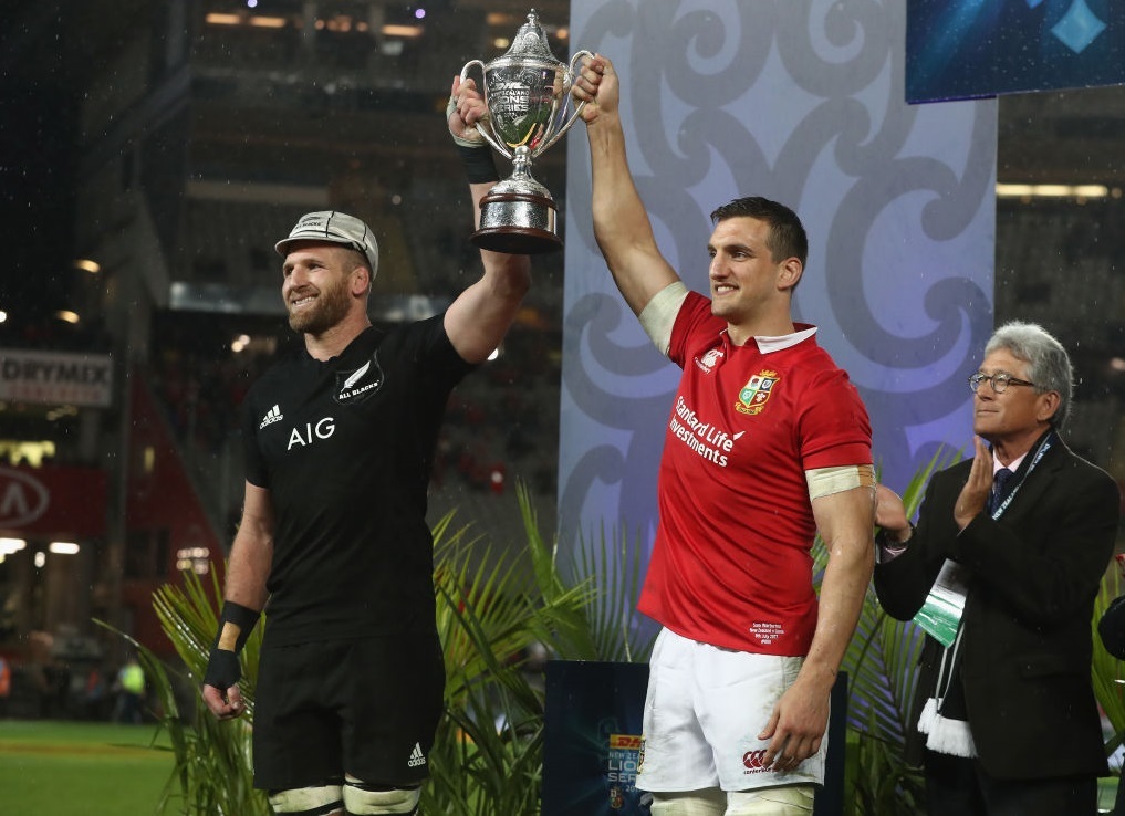 British and Irish Lions' Sam Warburton and New Zealand's Kieran Read lift the Series Trophy after the series is drawn. Photo / Getty