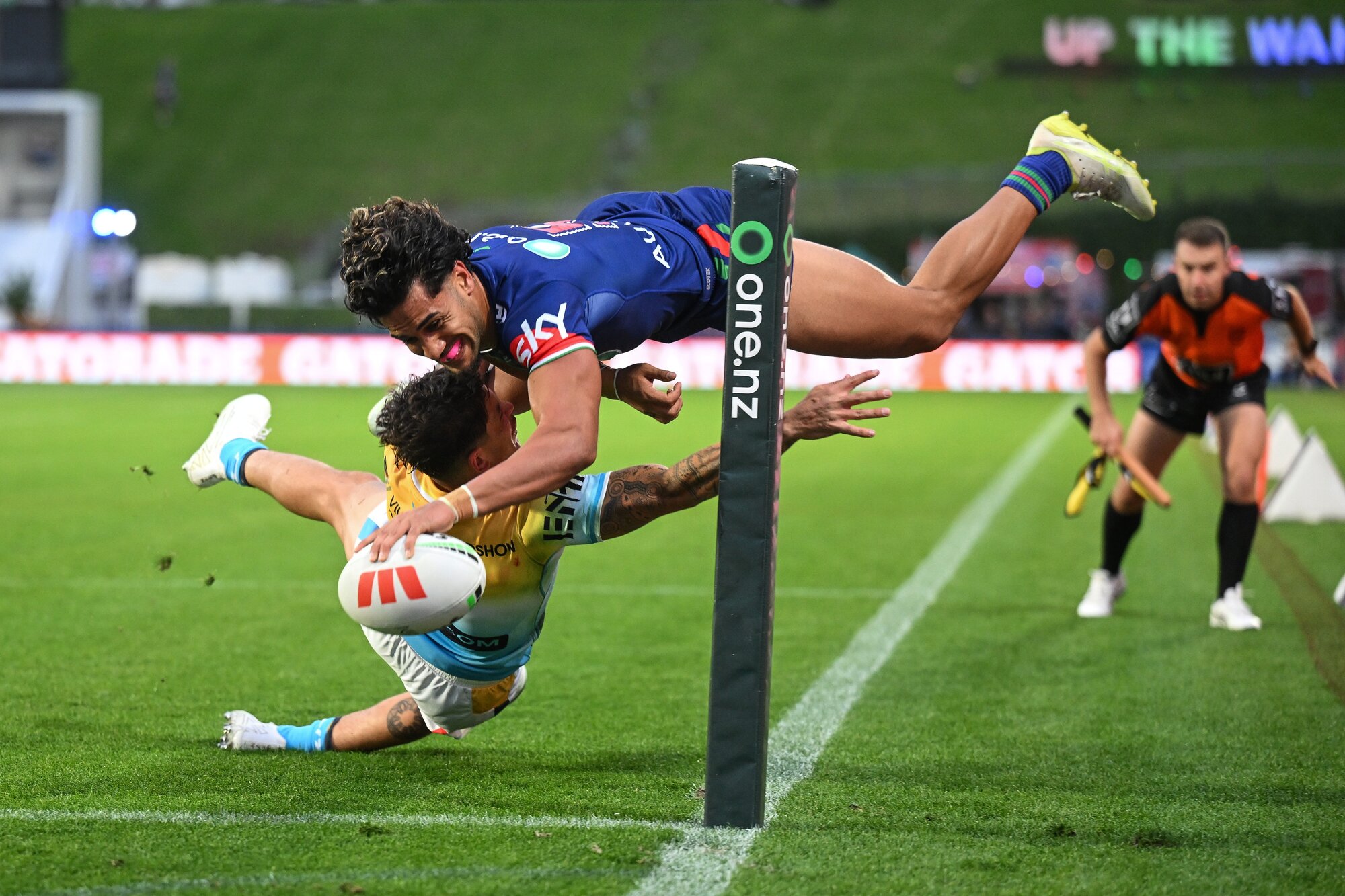 Warriors winger Alofiana Khan-Pereira flies through the air to score his second try against the Gold Coast Titans. Photo / Photosport