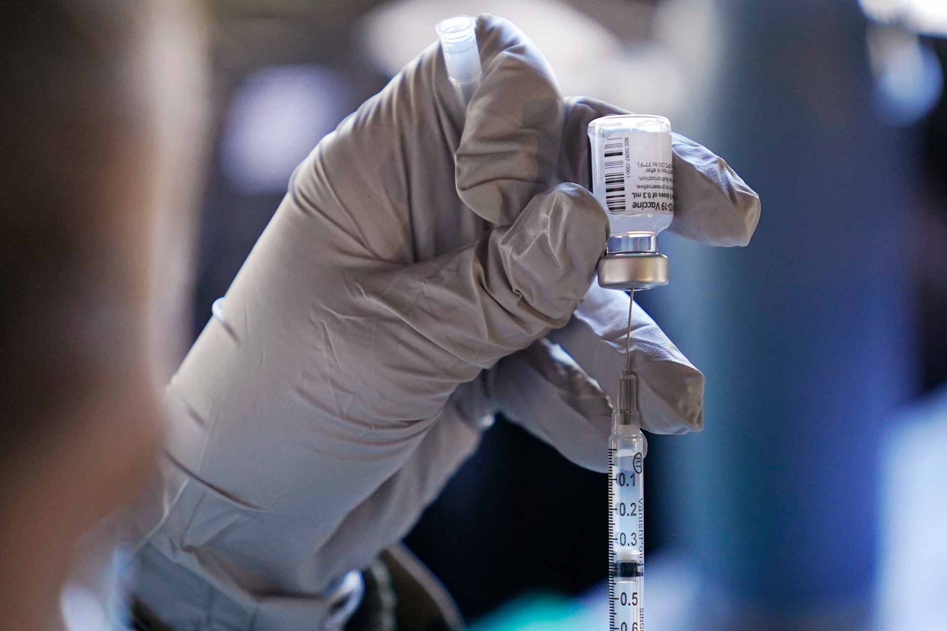 It's true that the Pfizer-BioNTech vaccine involves genetic material - but that doesn't mean it can modify our own. Photo / AP