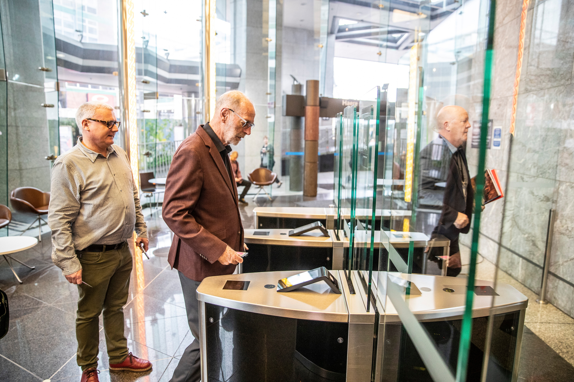 New mayor Wayne Brown (centre) entering the Auckland Council building with his adviser Matthew Hooton (left) and the council's head of democracy services, Phil Wilson. Photo / Michael Craig