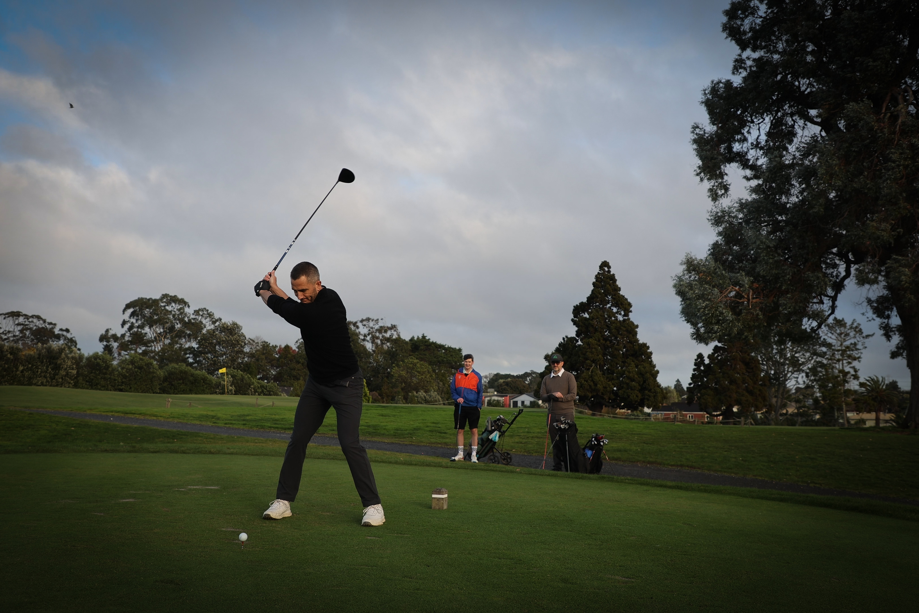 America's Cup champion Blair Tuke joined Christopher Reive and Cameron McMillan for a round at Royal Auckland and Grange Golf Club. Photo / Michael Craig


