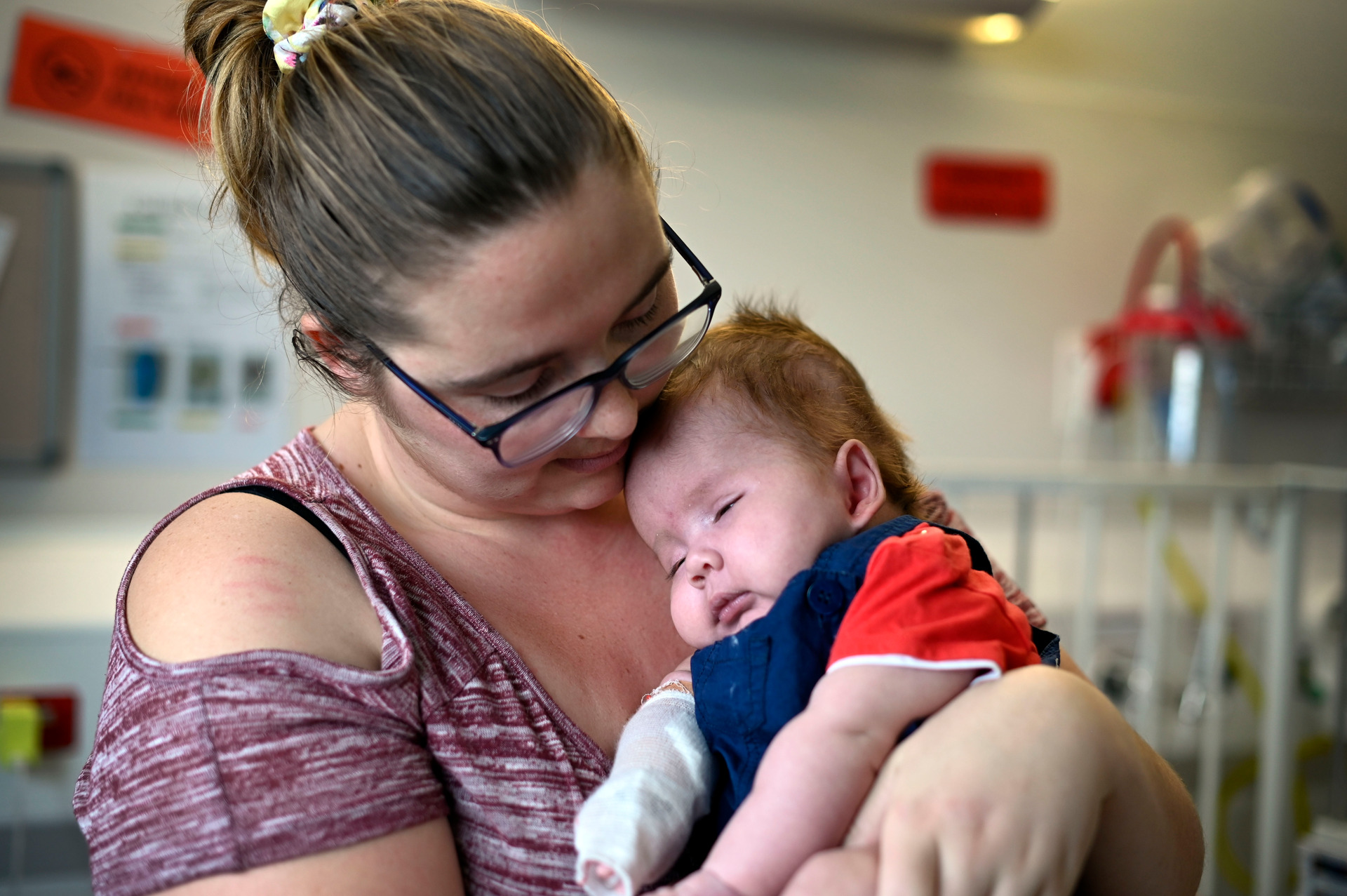 Daxton gets a cuddle from his mum Eden Anderton. Photo / George Novak