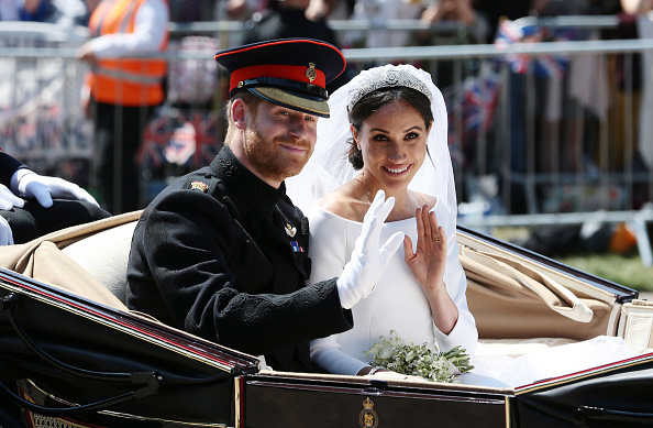 Prince Harry, Duke of Sussex and Meghan, Duchess of Sussex wave from the Ascot Landau Carriage on their wedding day. Photo / Getty Images