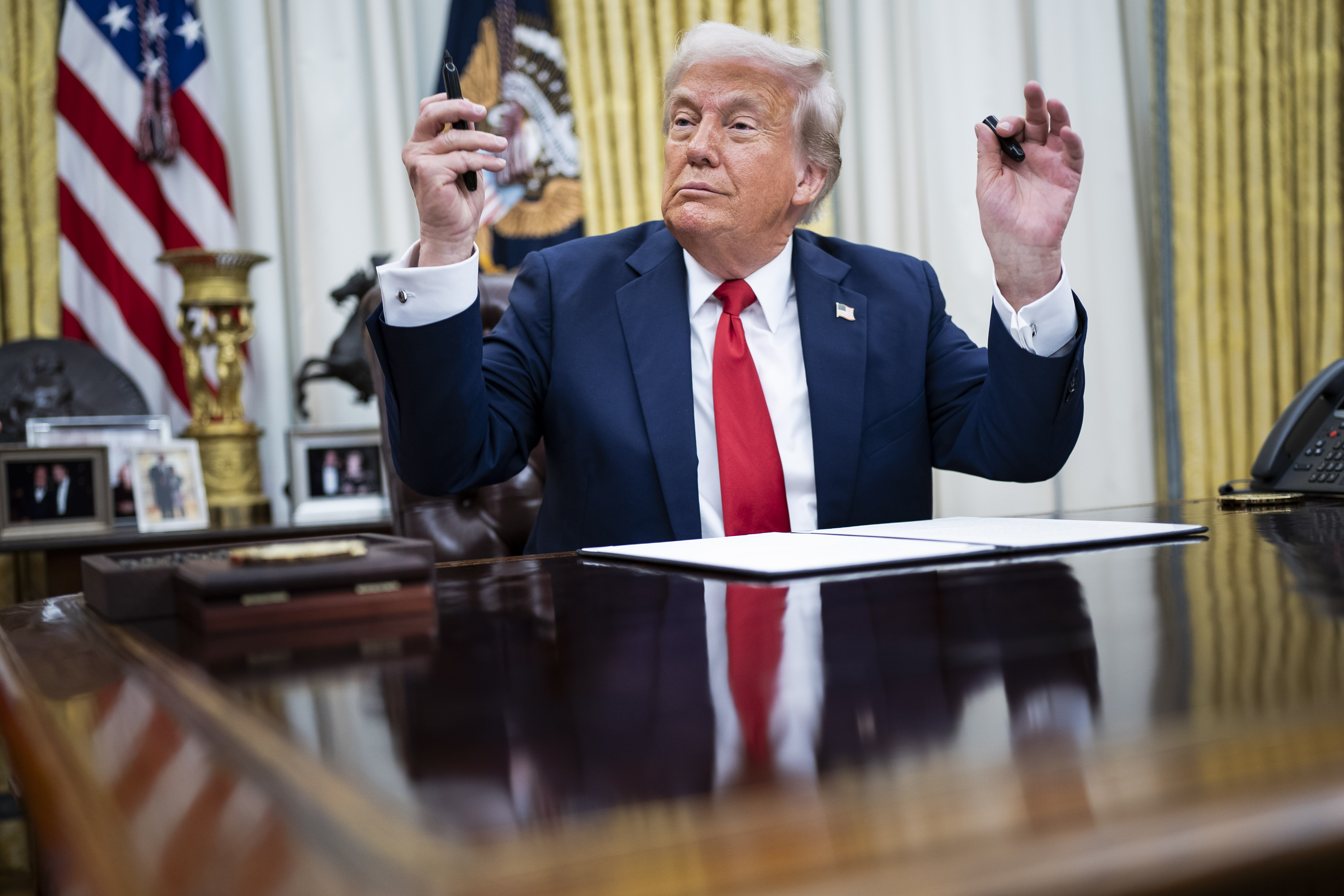 President Donald Trump speaks to reporters and signs an executive order about enforcement in the concert and entertainment industry. Photo / The Washington Post