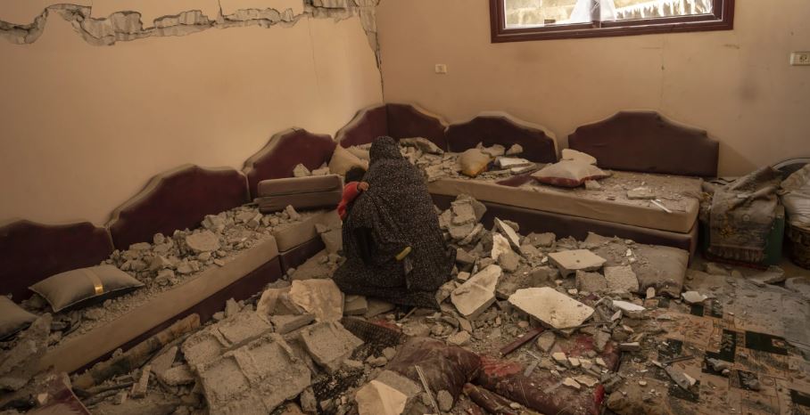Members of the Abu Sinjar family inspect their house after it was hit by an Israeli airstrike in Rafah, southern Gaza Strip. Photo / AP