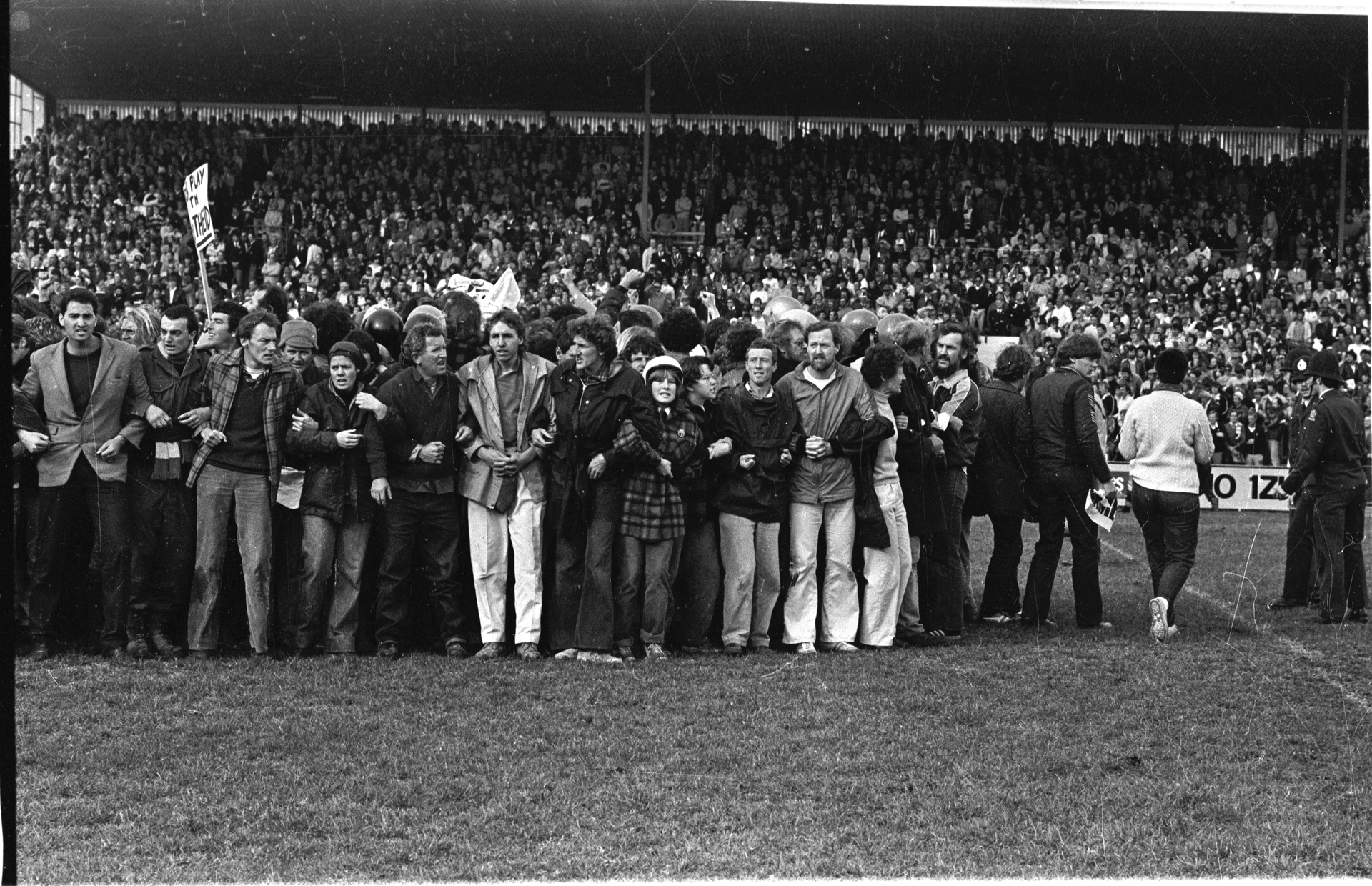 Protesters stand mid-field at Rugby Park, Hamilton in July 1981. Photo / John Sefton