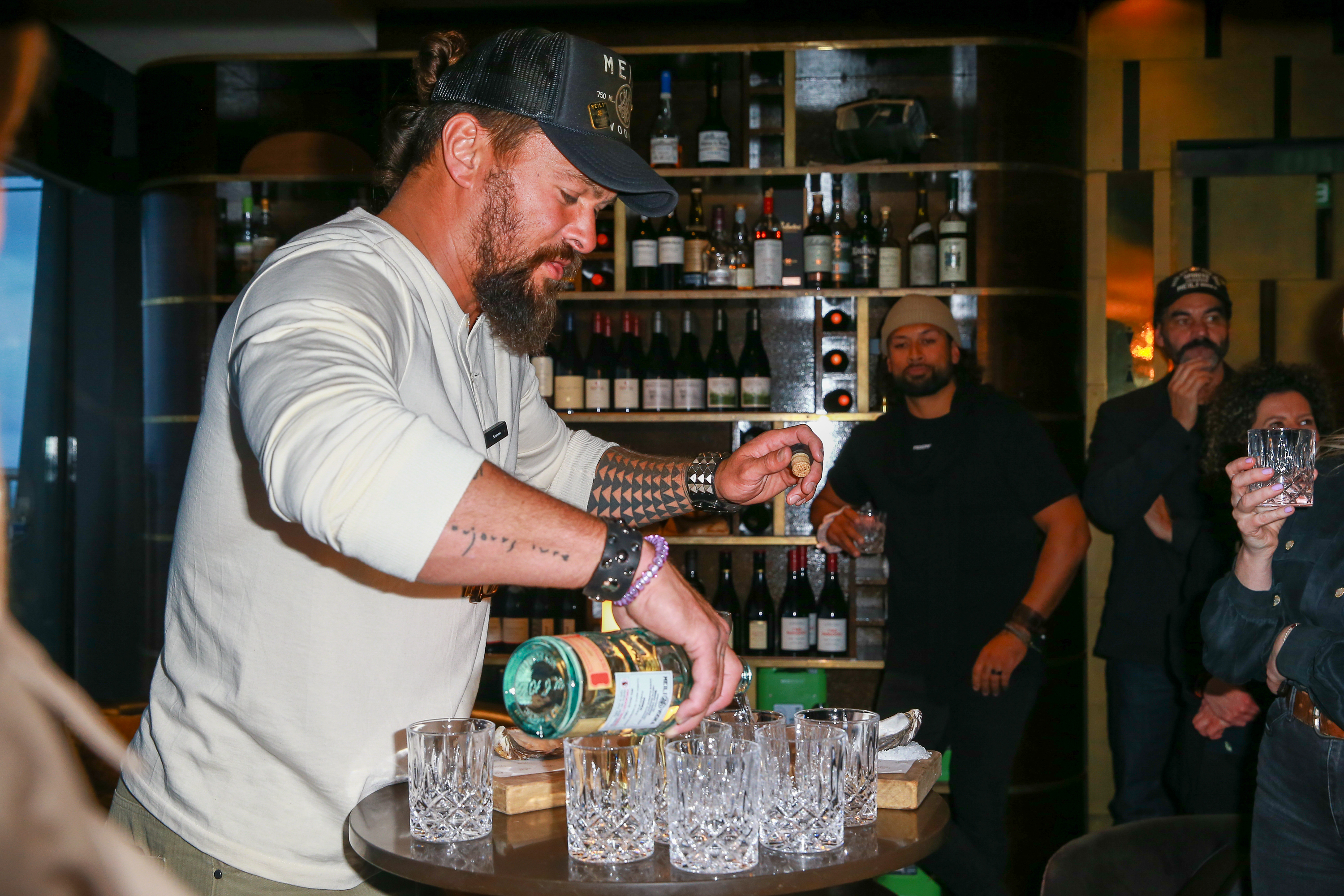 Jason Momoa mixing drinks. Photo / Supplied