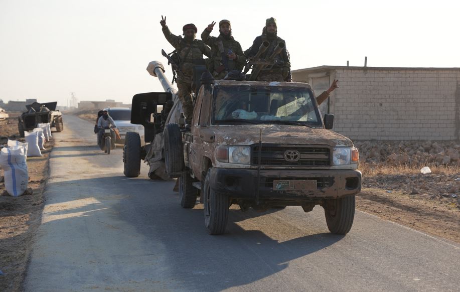 Rebels In Northwest Syria seized military vehicles belonging to the regime along the route toward Kweris Airpor. Photo / AFP