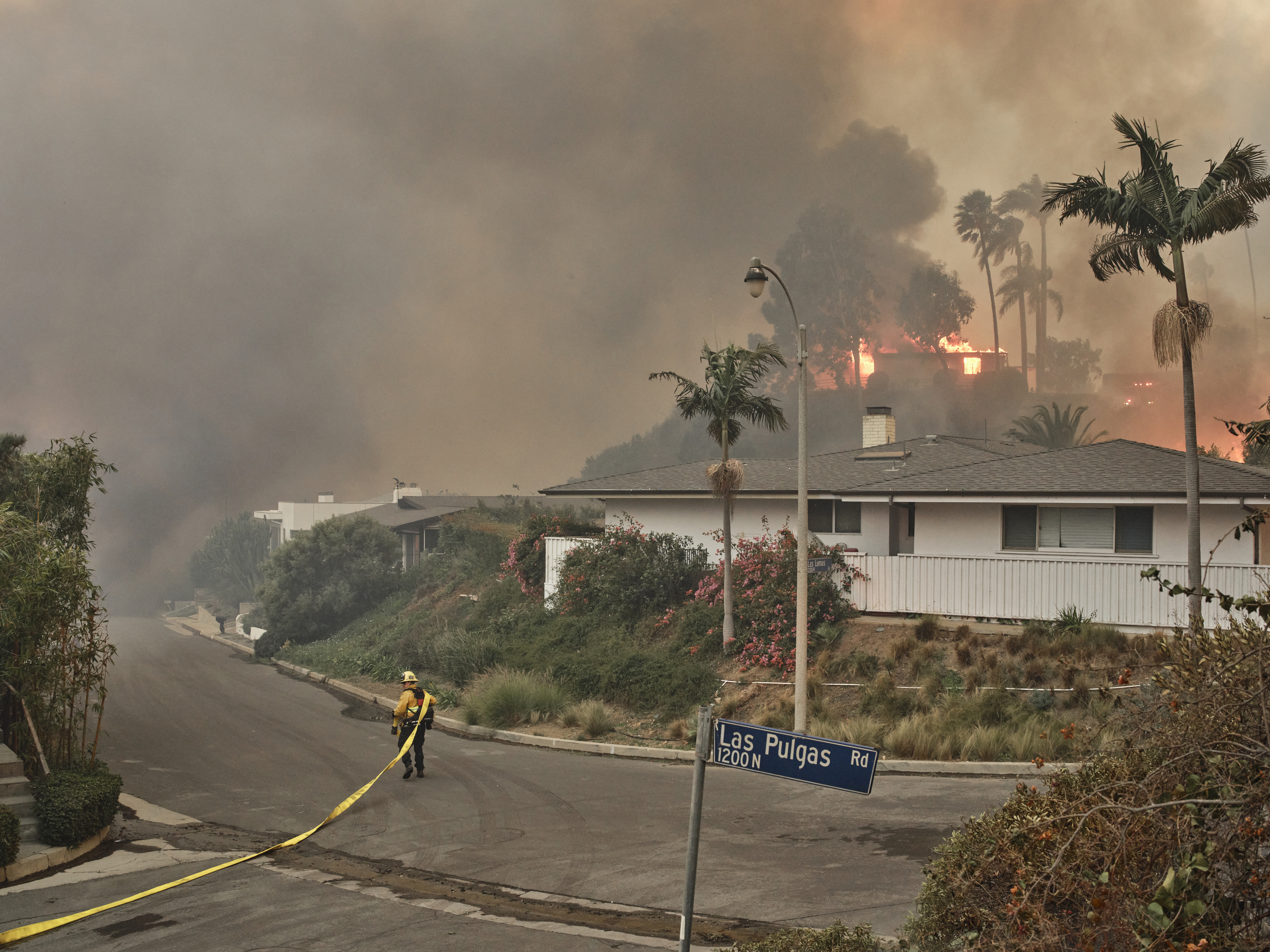 Firefighters battle the Palisades fire in the Pacific Palisades neighbourhood in Los Angeles on January 7. Photo / Philip Cheung, The New York Times