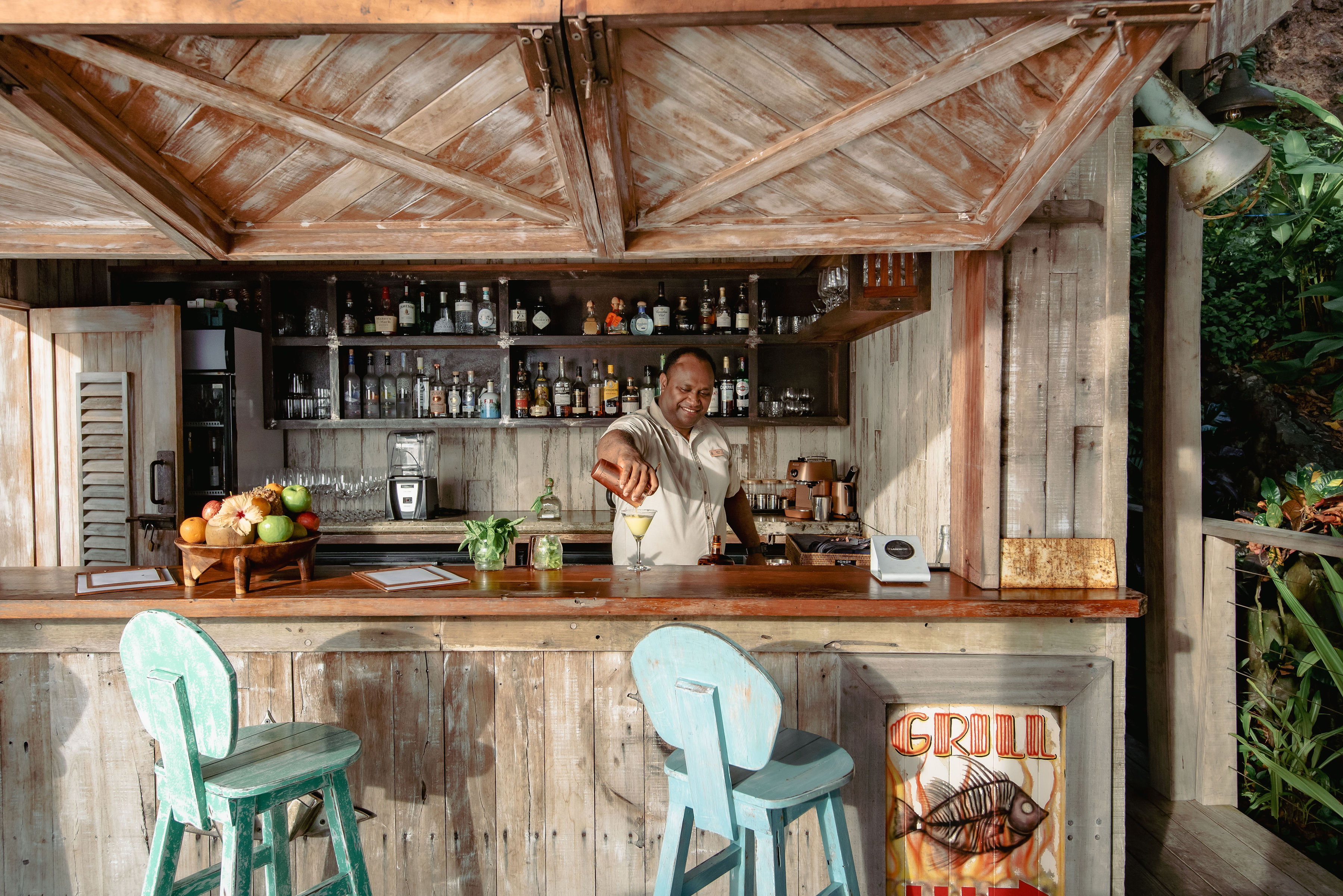 Kokomo's beachside bar serves tropical cocktails with signature Fijian hospitality.