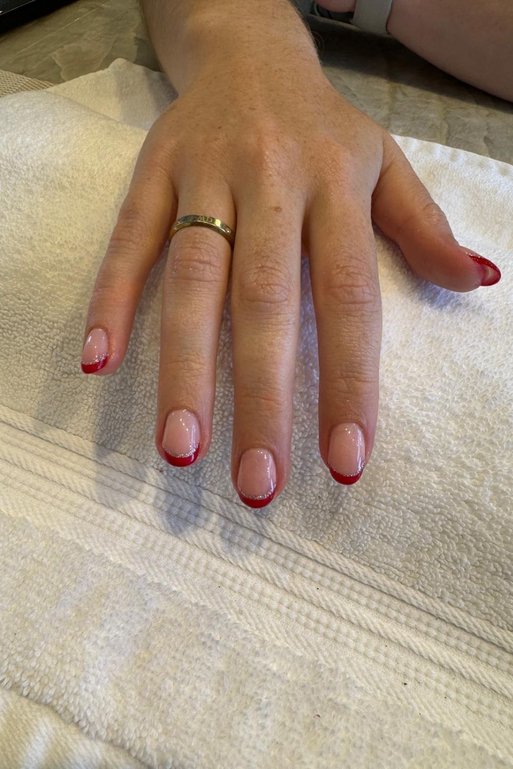 Consider switching up your French tip in a trending shade like deep cherry red. Photo / Valet Nails
