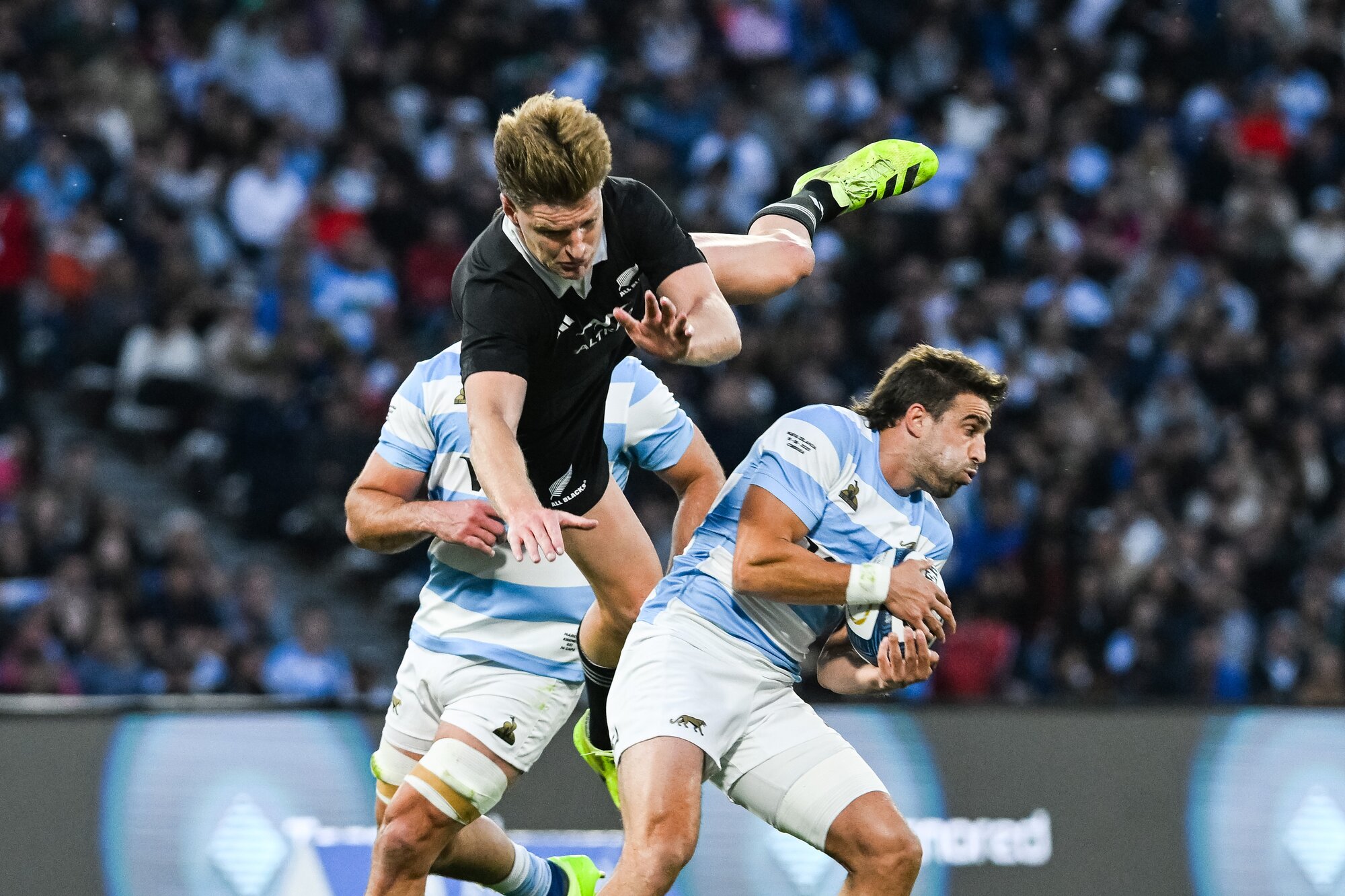 Argentina's fullback Juan Cruz Mallia gets the ball away as Jordie Barrett flies high. Photo / Photosport