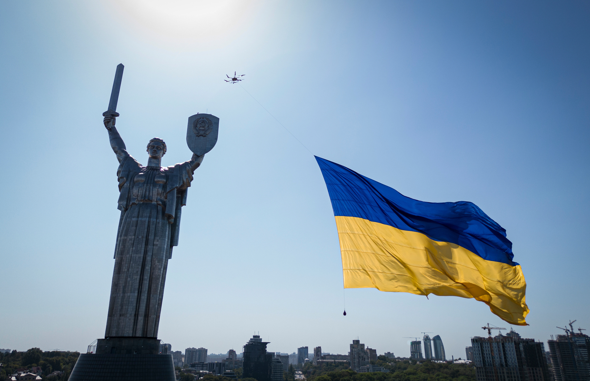 A drone carries a big national flag in front of Ukraine's the Motherland Monument in Kyiv, Ukraine. Photo / AP