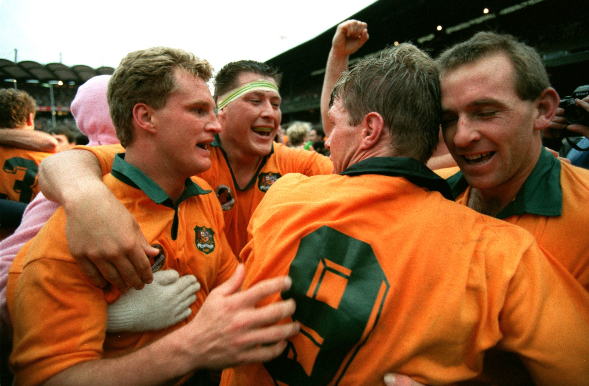 Michael Lynagh (left) and teammates celebrate winning the Rugby World Cup final in 1991. 