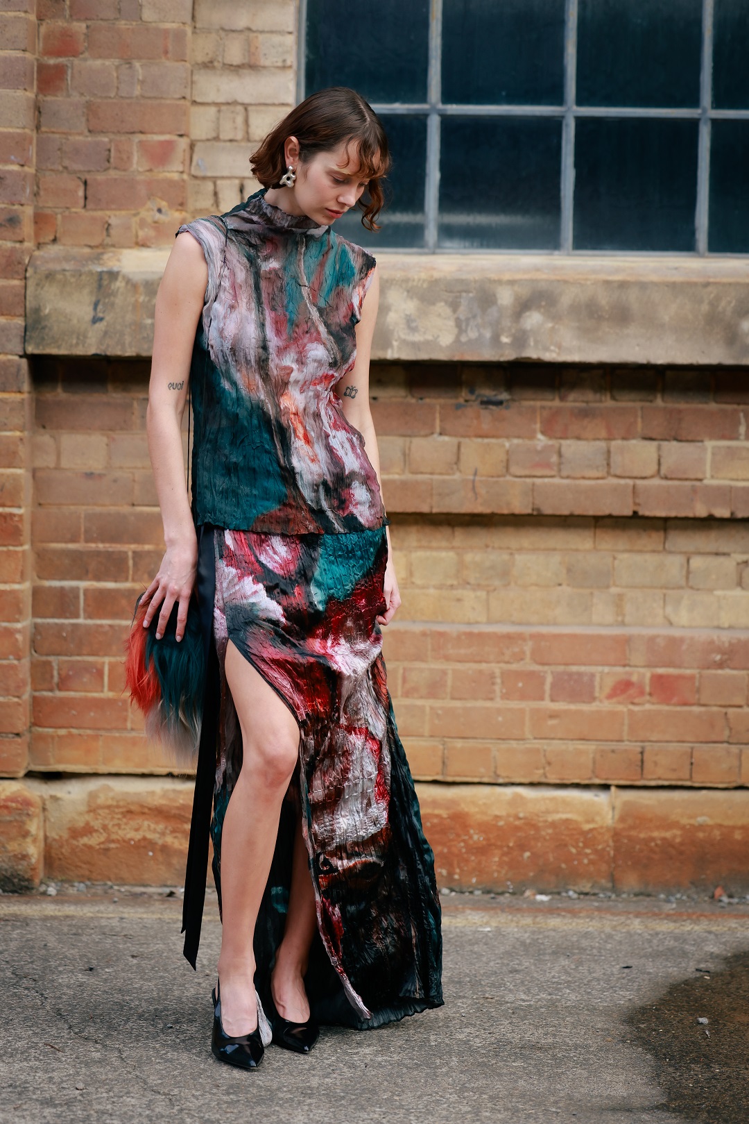 New Zealand model Emma Boyd in a printed set and complementary fur bag. Photo / Hanna Lassen, Getty Images