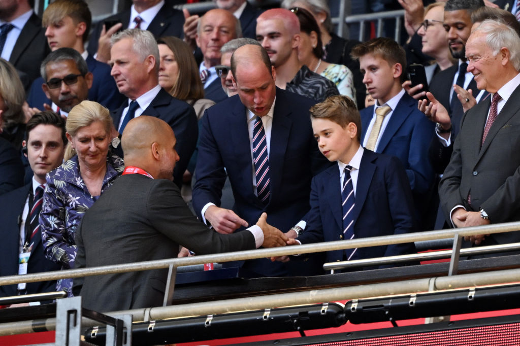Prince George of Wales shakes hands with Pep Guardiola, Manager of Manchester City, after the Emirates FA Cup Final match between Manchester City and Manchester United at Wembley Stadium on May 25, 2024 in London. Photo / Getty Images