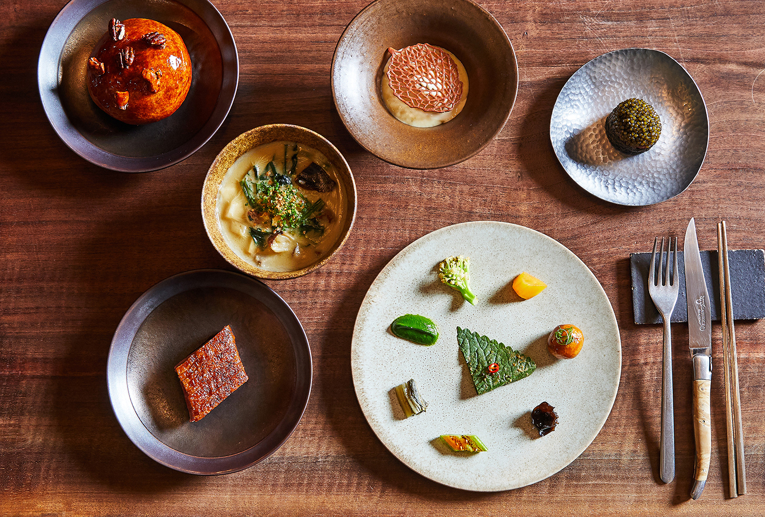 A variety of dishes served at Jua in New York. The high heat and penetrating smoke of the fire weave through the menu at Jua. Photo / Rachel Vanni, The New York Times