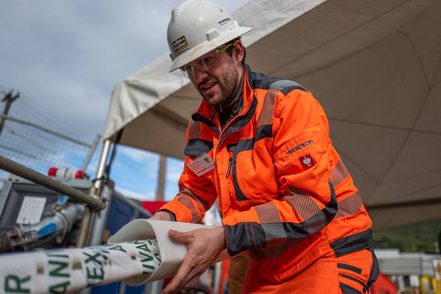 Max Vollenbroich of German firm Amex-Sanivar helping to guide through a high-strength liner to fix one of the broken sludge pipes underneath Mt Albert. Photo / Supplied